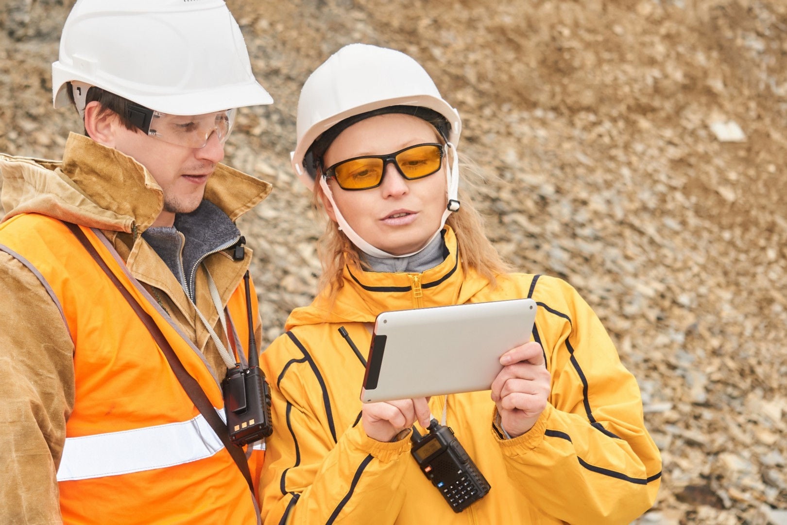 workers scanning area with tab