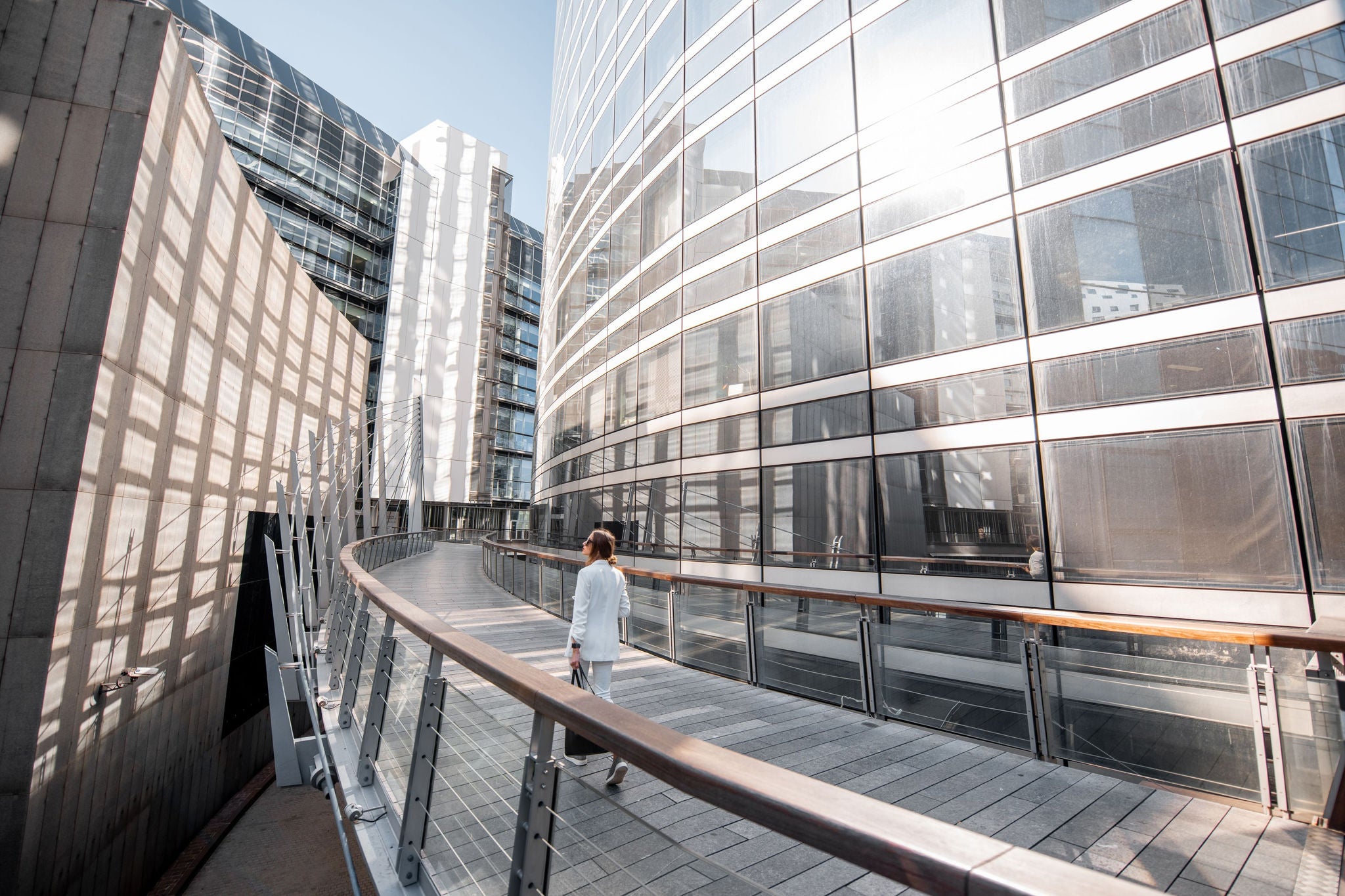 Woman walking in between buildings