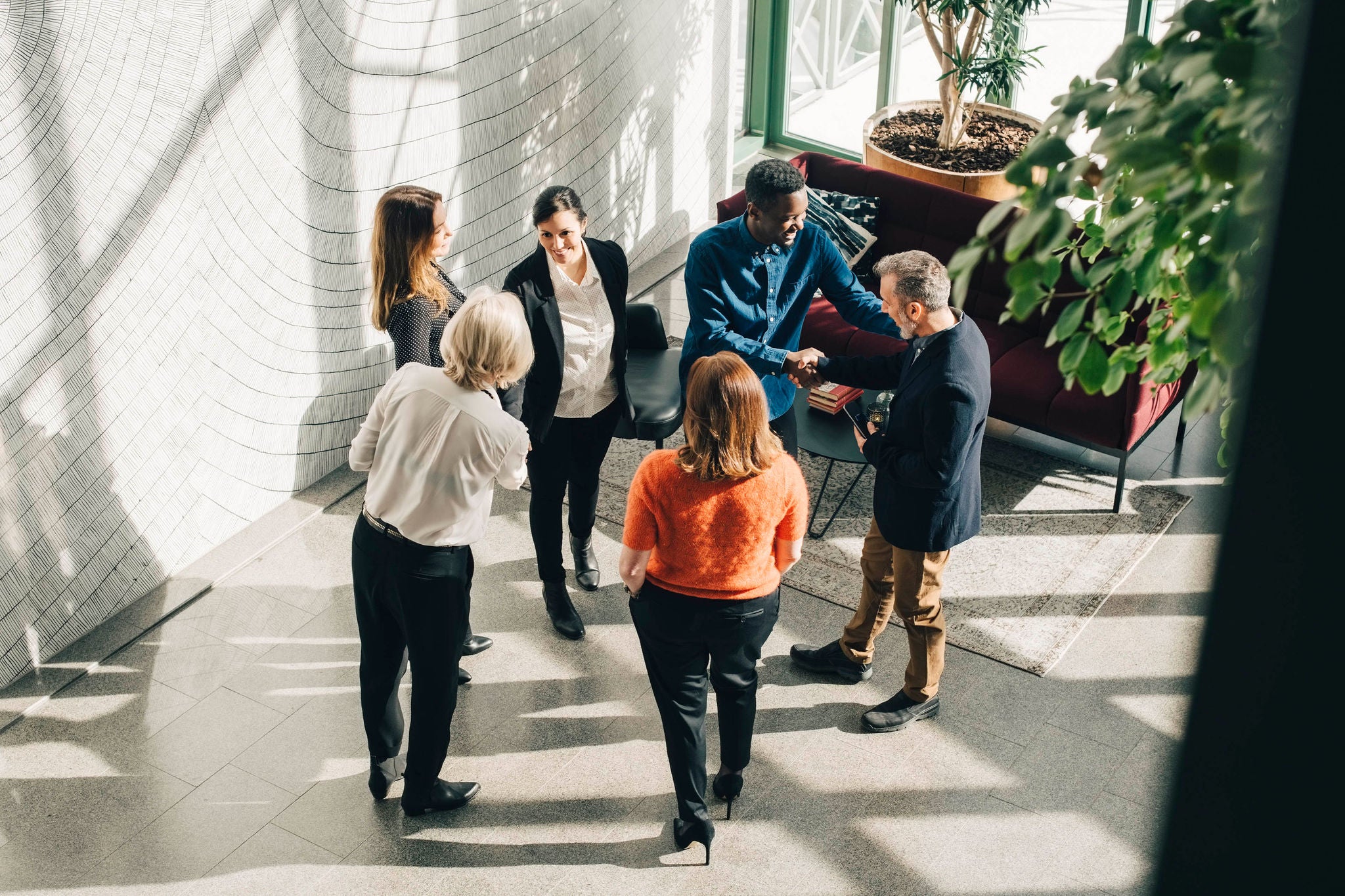 Group of people talking in hallway