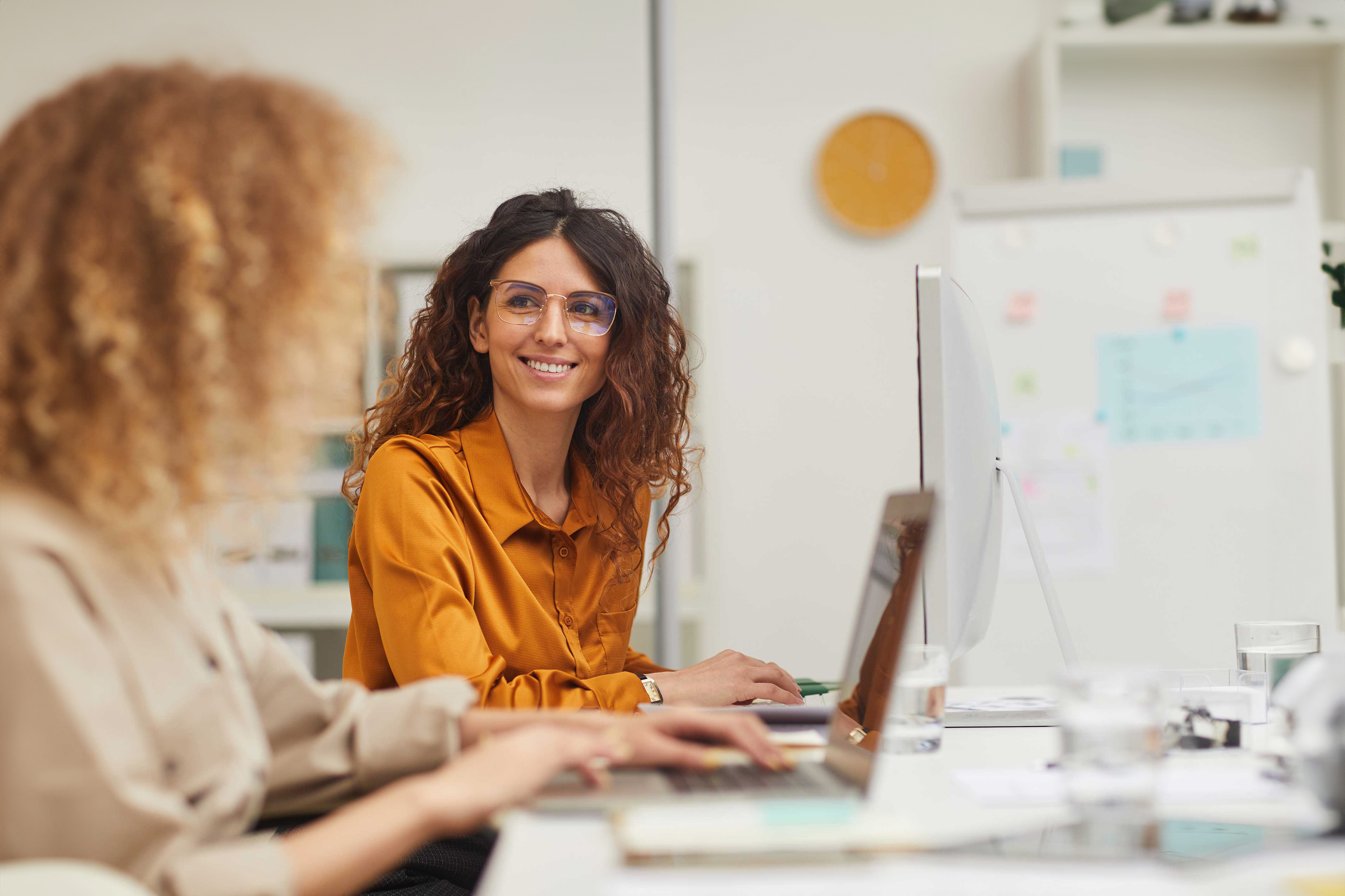 Businesspeople sitting in modern office desk