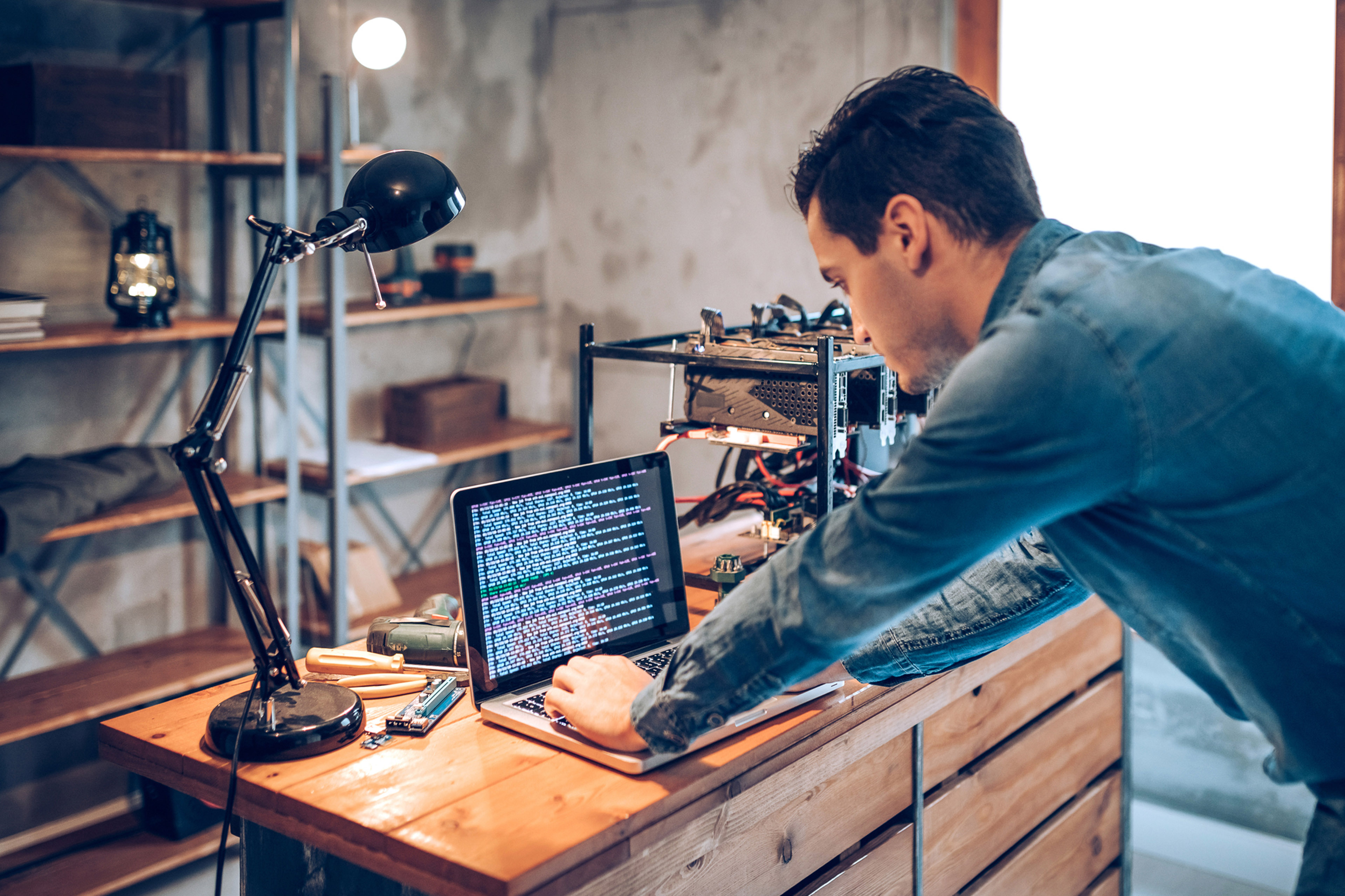 Photo of man using laptop