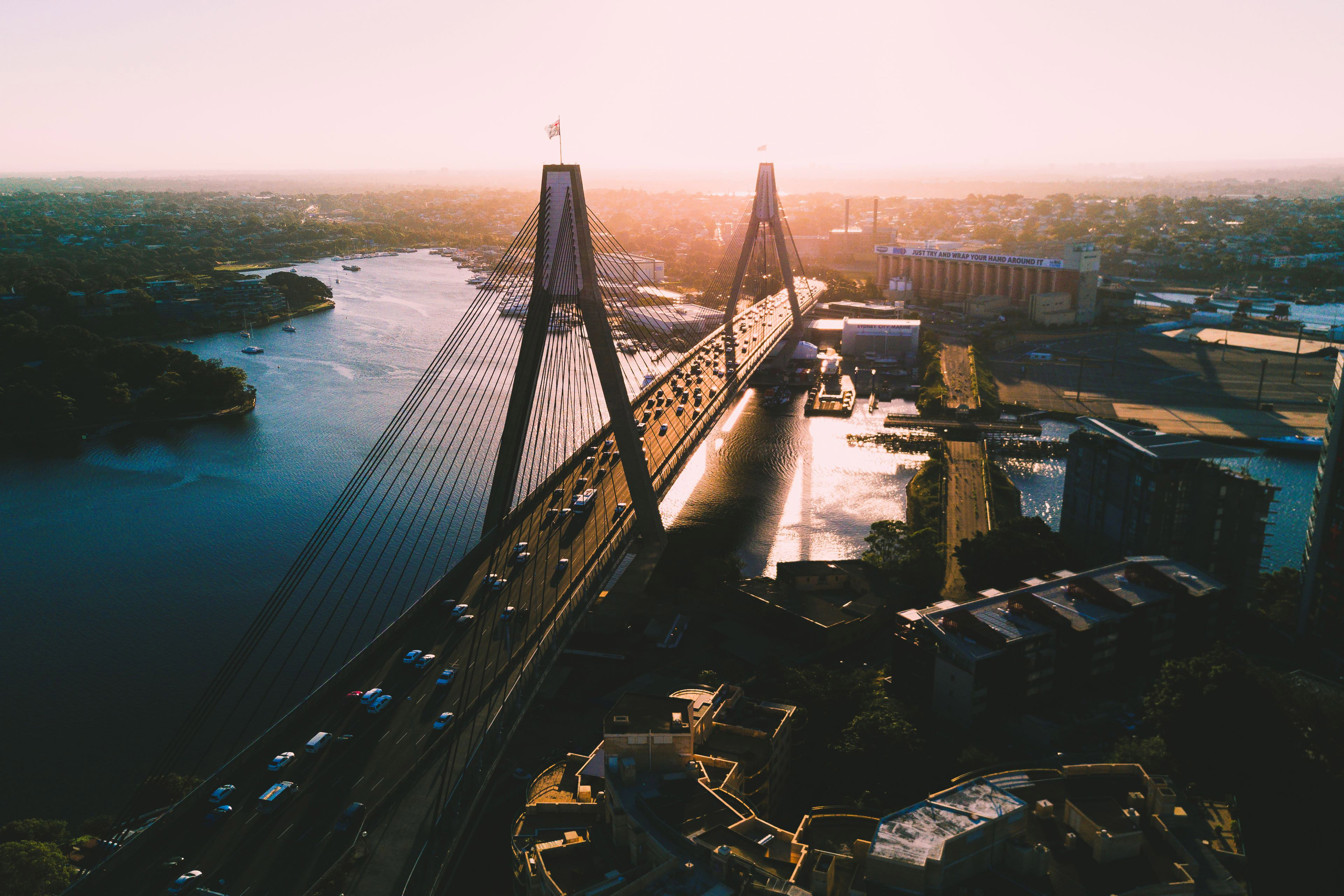 City sunset overlooking bridge with traffic