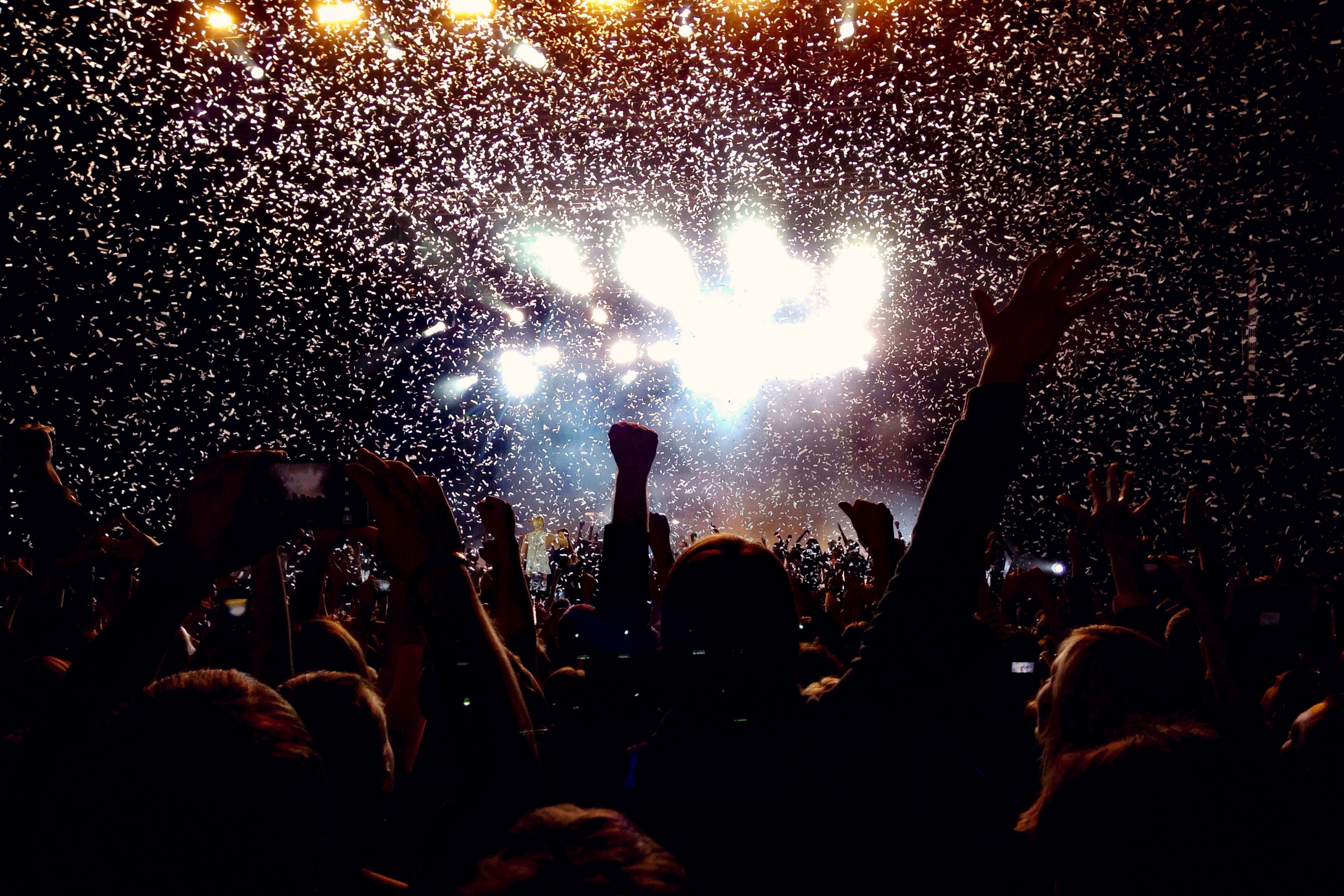 Rear view of people enjoying music concert