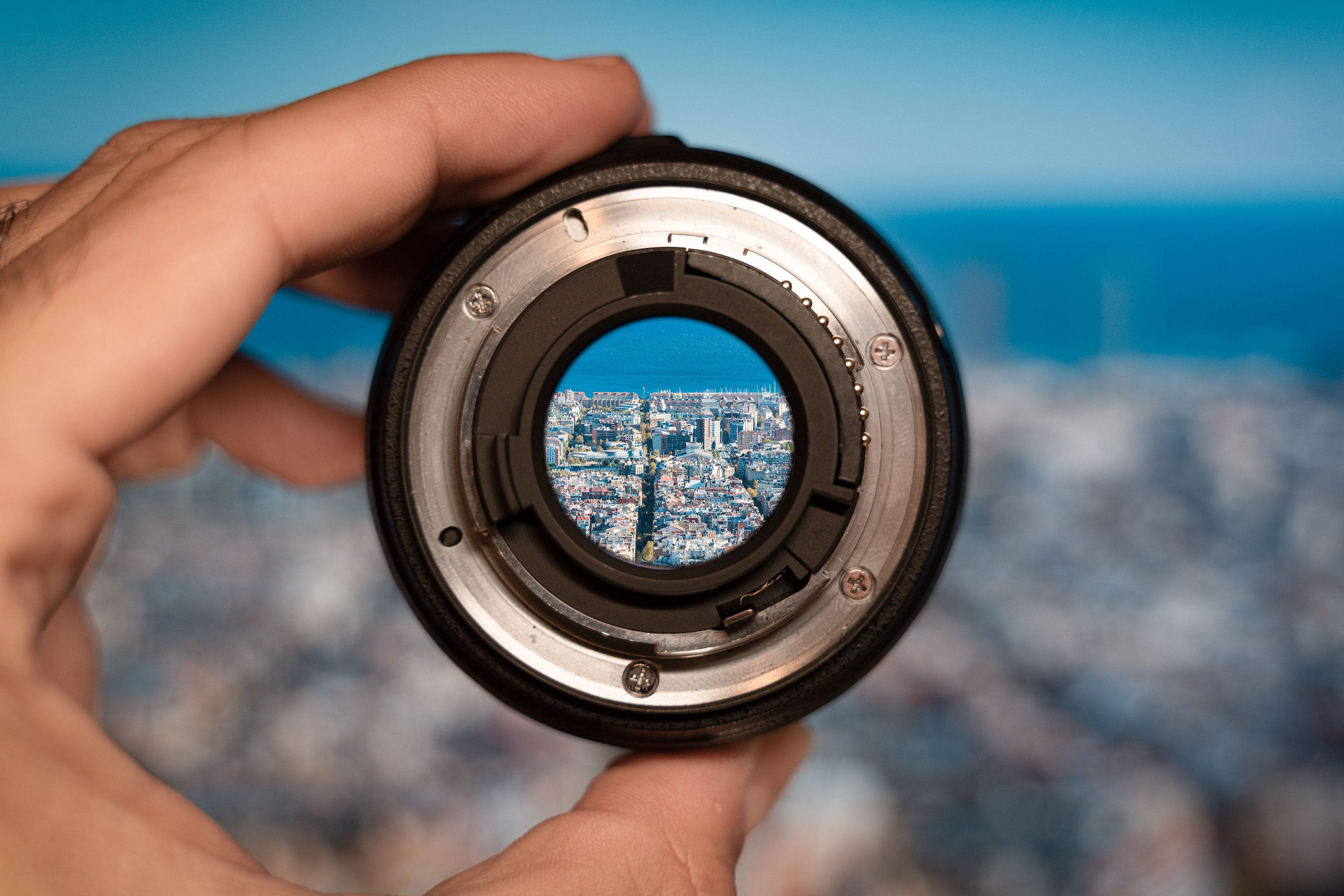 Person looking at city through magnet