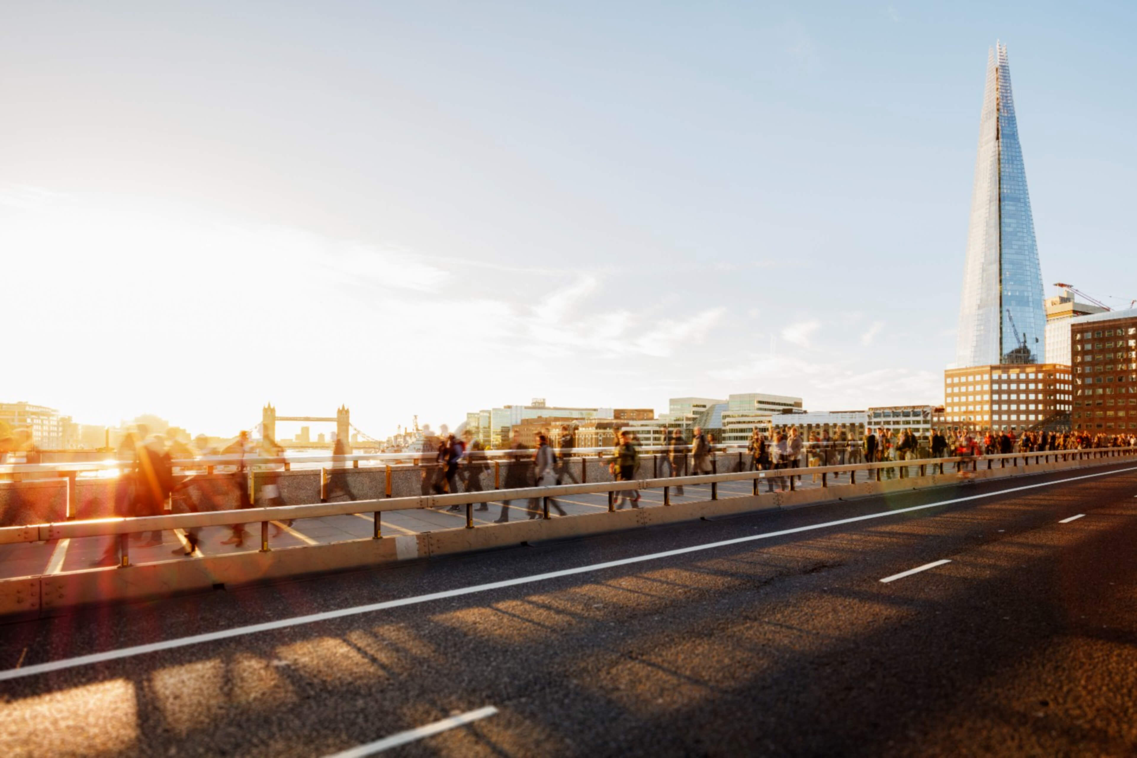 EY - Group walking on city bridge