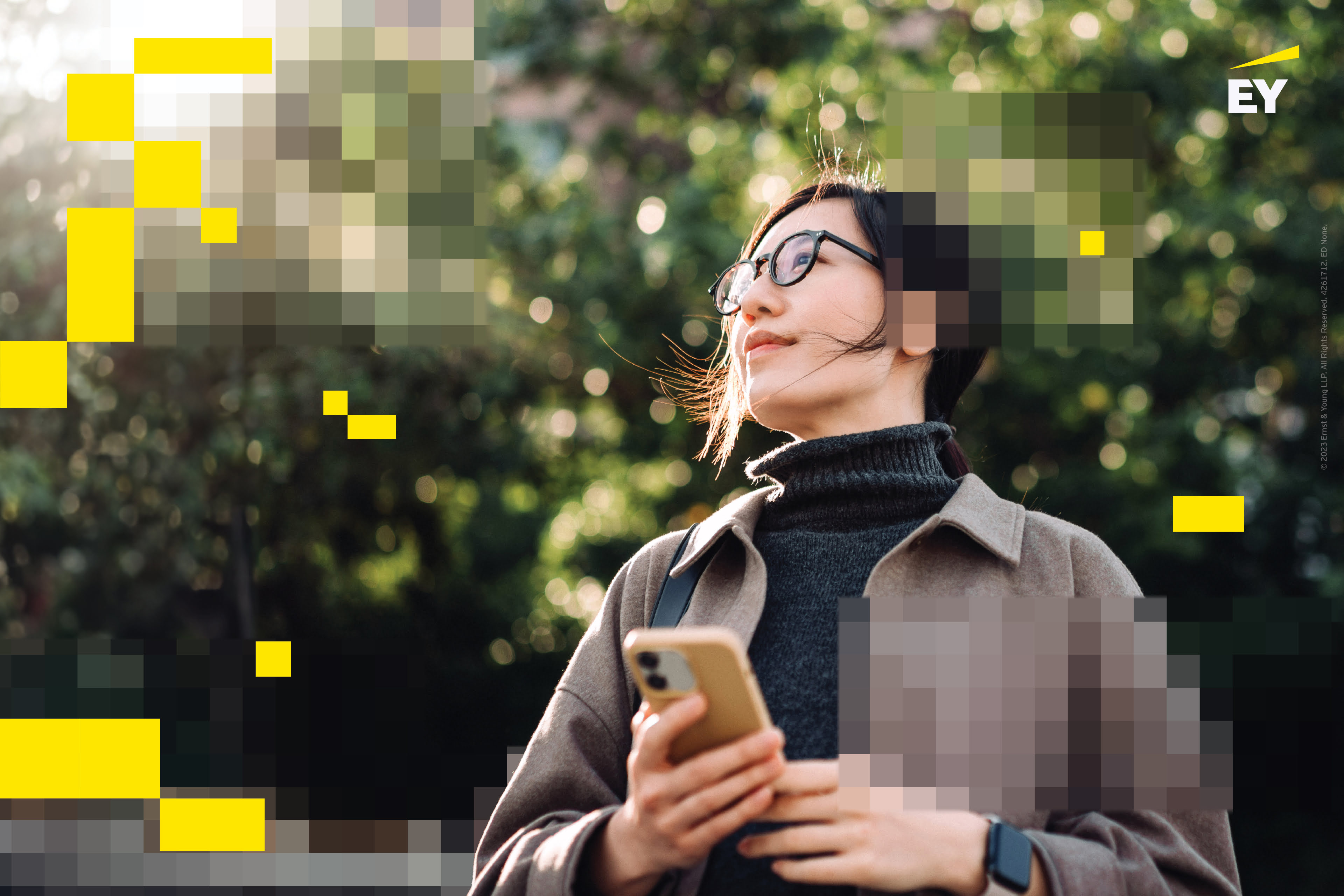 Woman standing by holding phone in hand