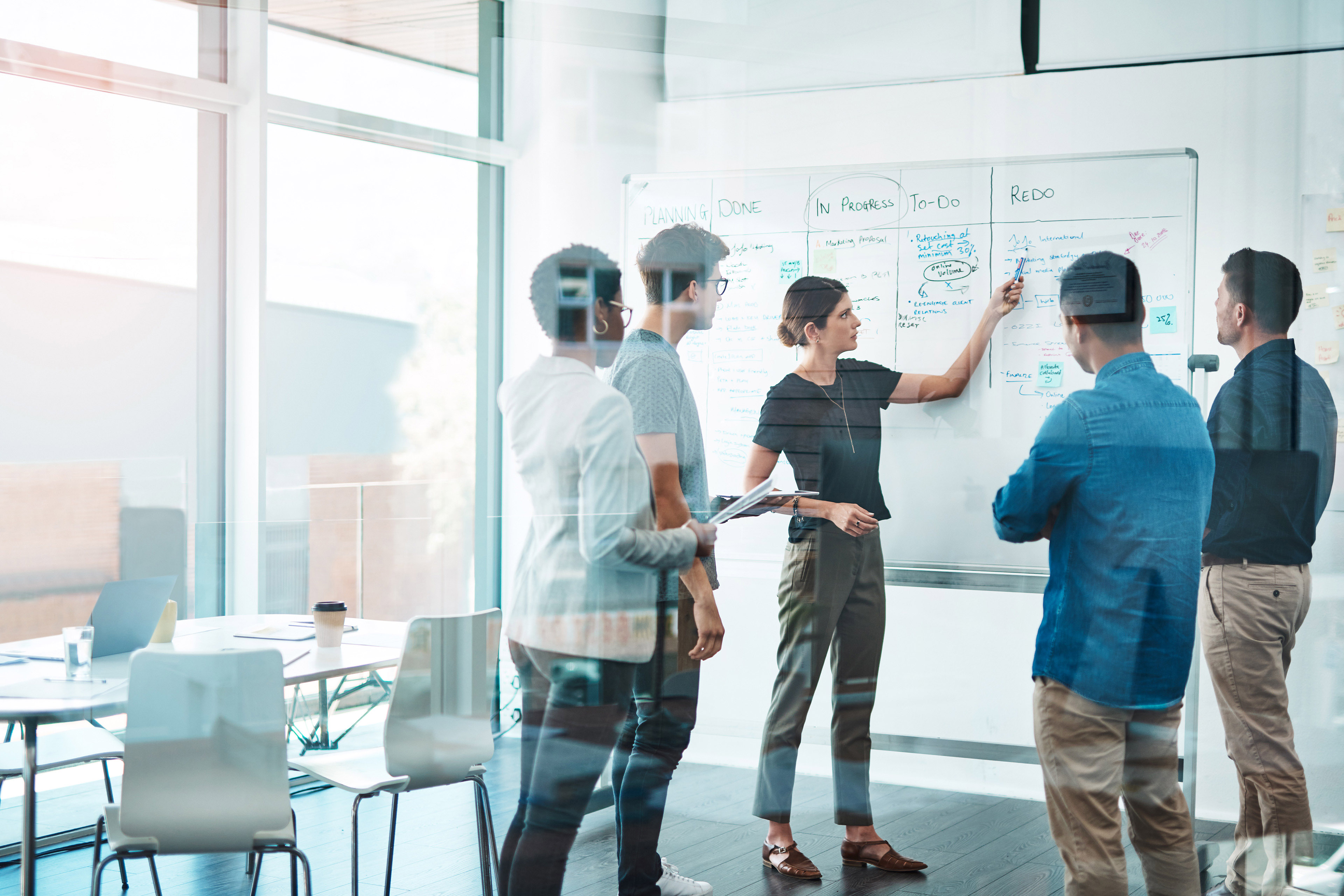 Image of a group of businesspeople having a meeting in a modern office