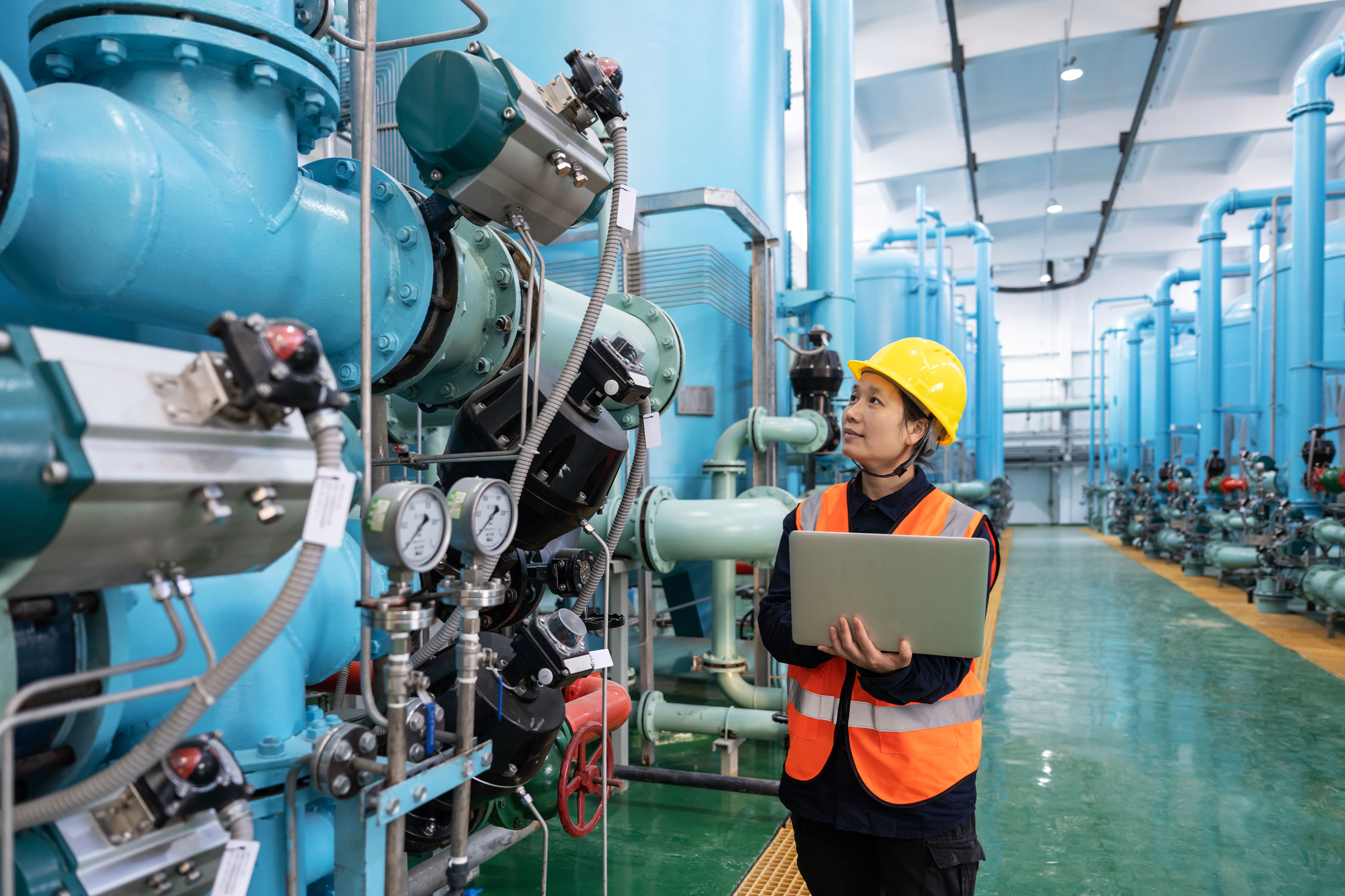 Female engineer works in a chemical plant