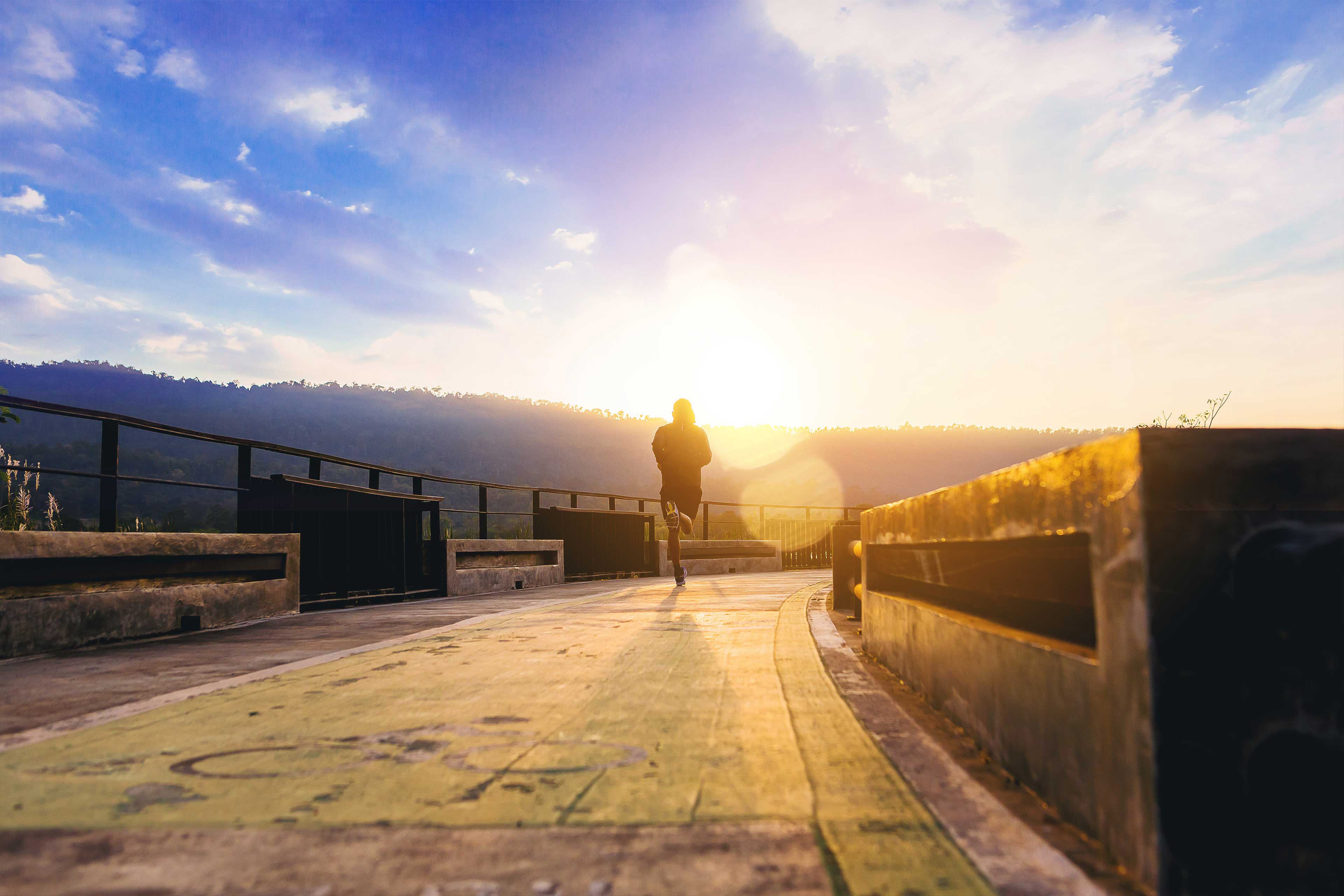 man jogging on walk way