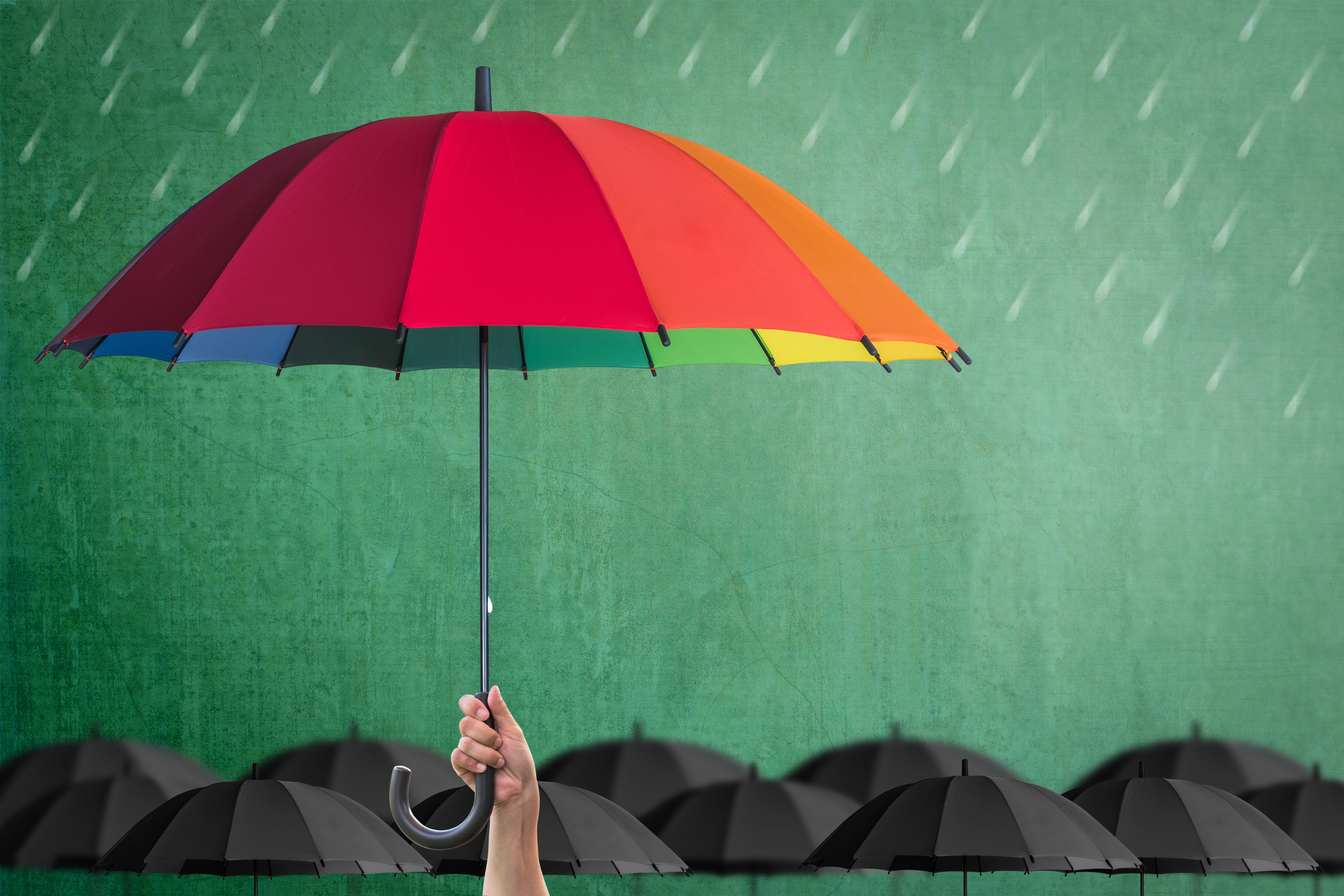 Colourful umbrella held up