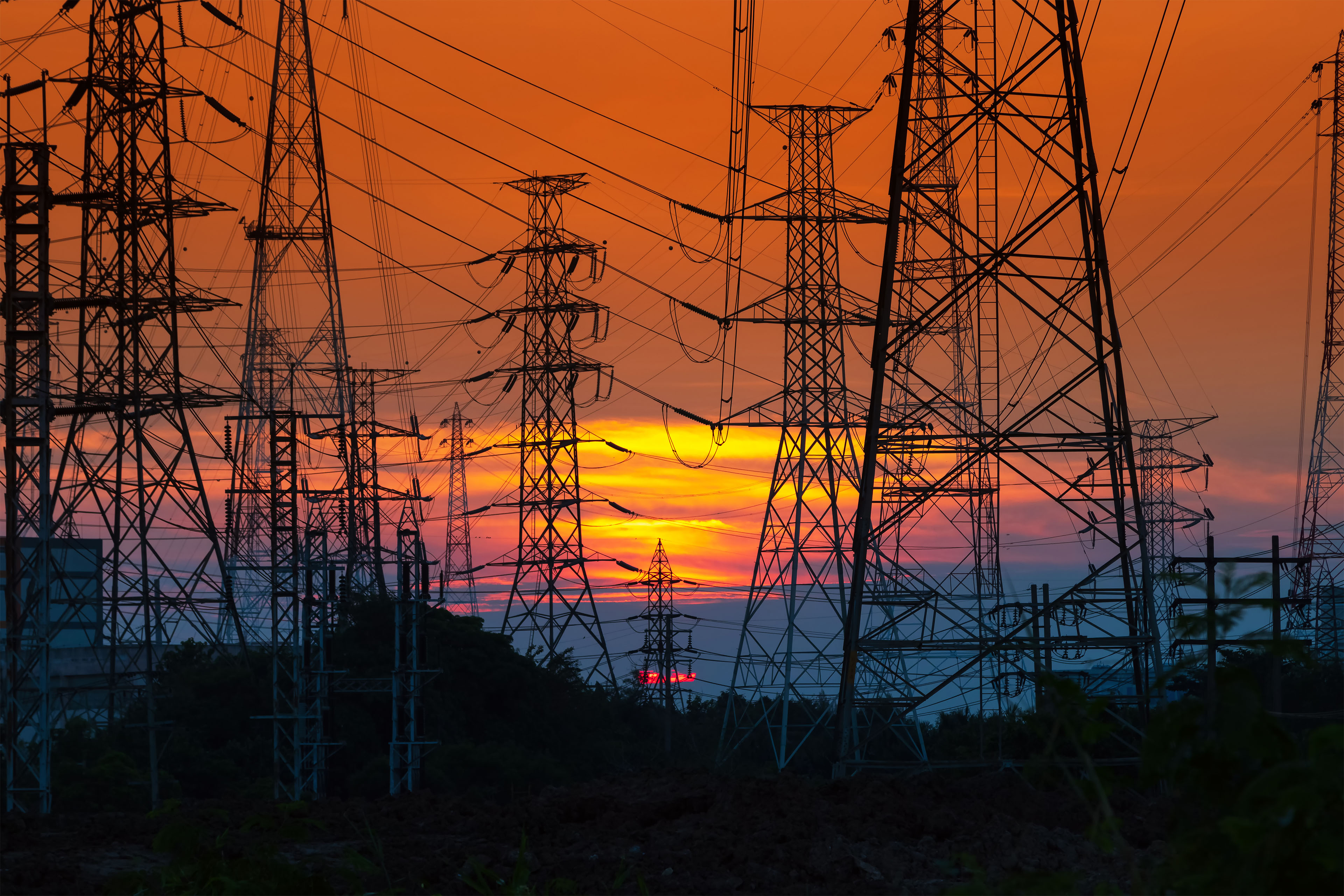 Electricity distribution station and towers at sunset