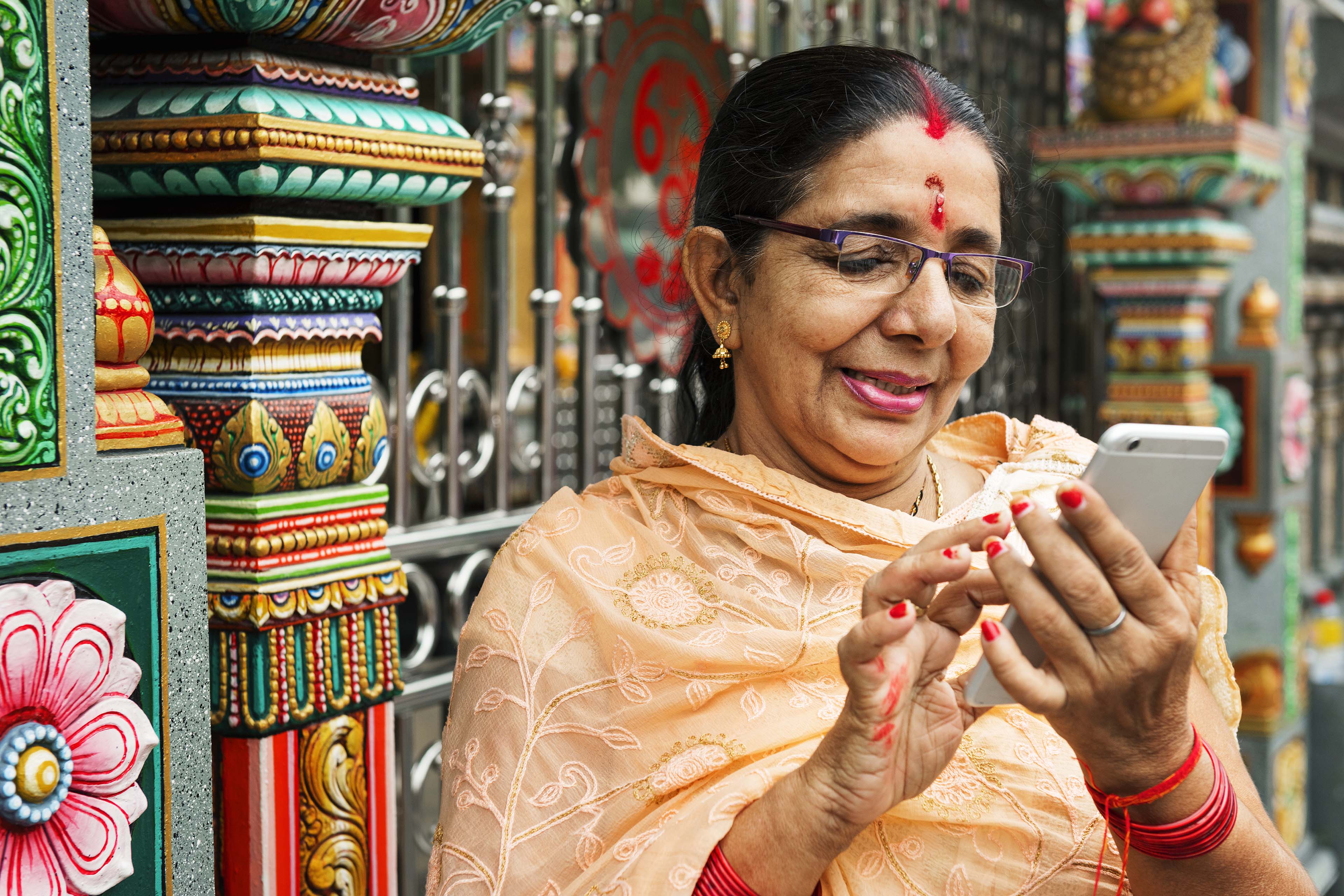 Indian women using mobile phone