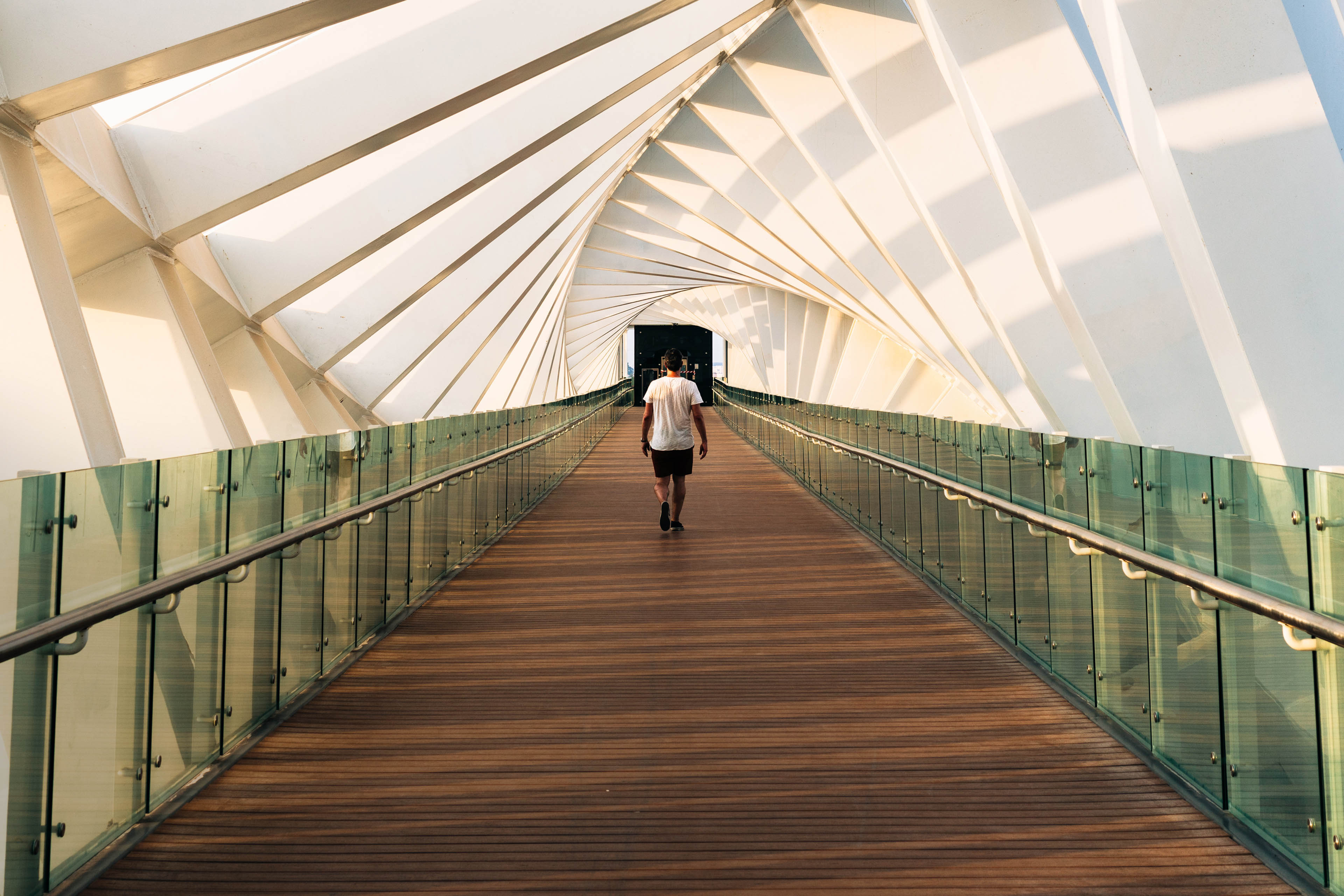 Man walks along a footbridge