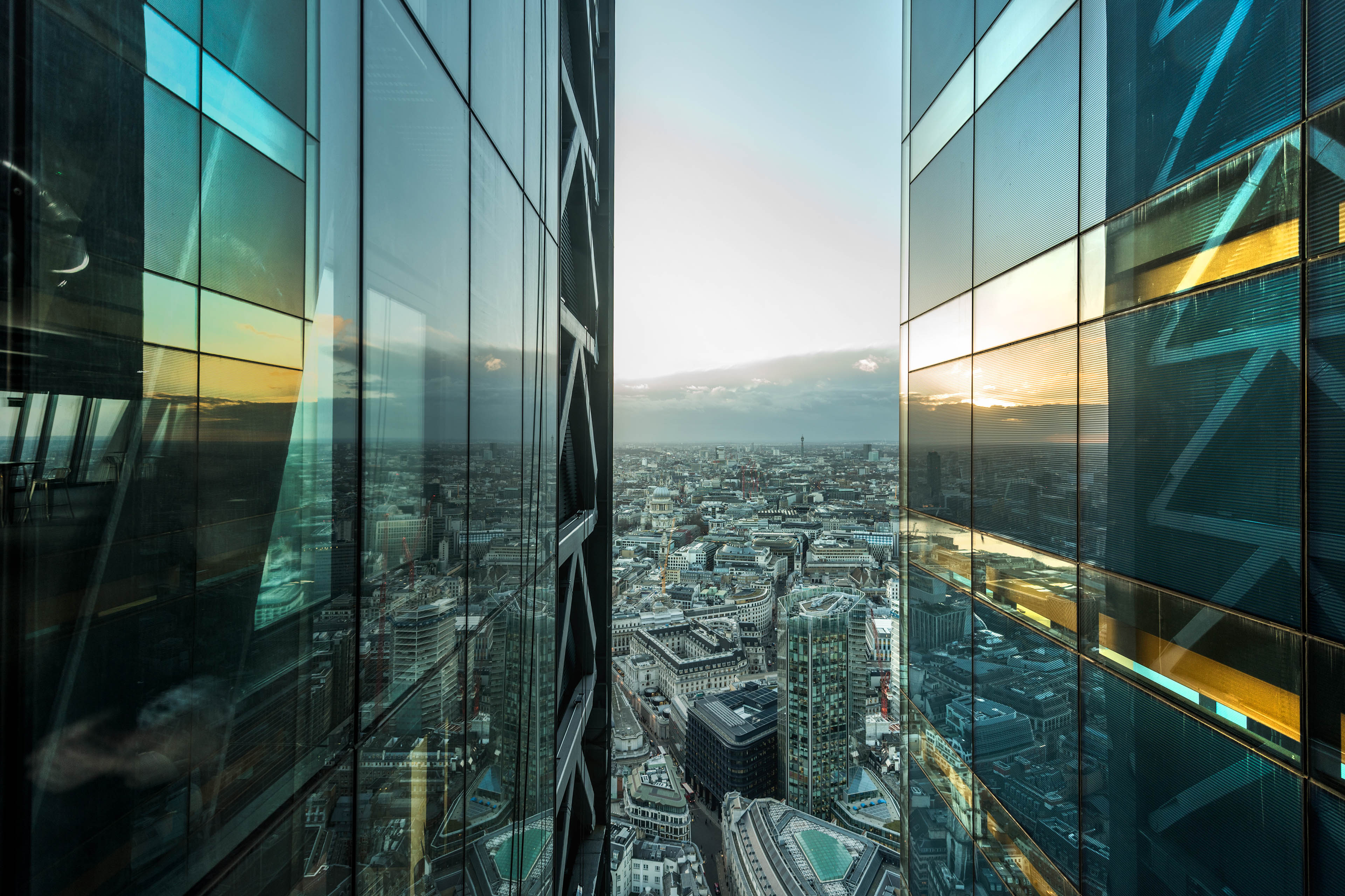 Aerial view of a city with glass buildings