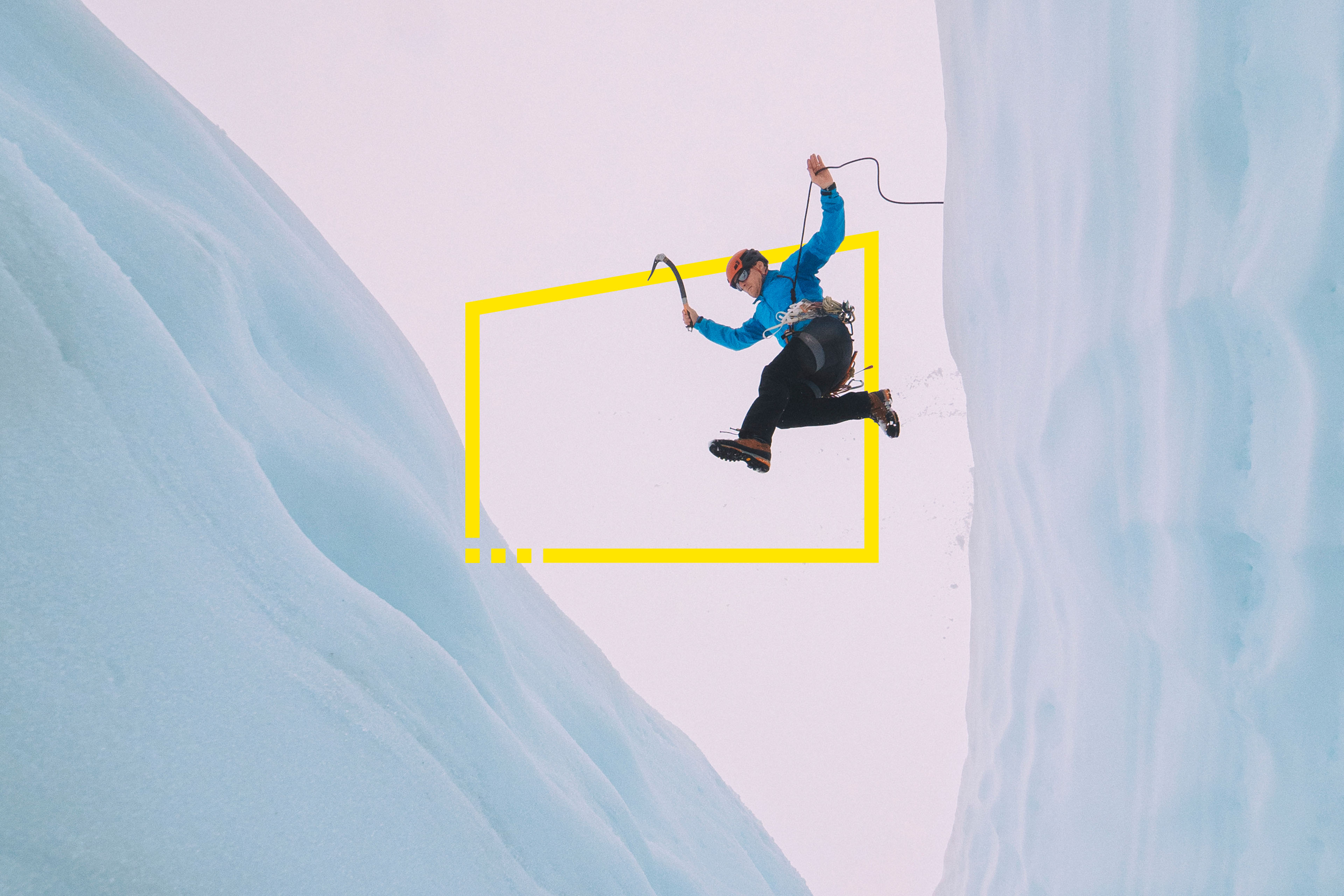 Mountaineer jumps over large crevasse