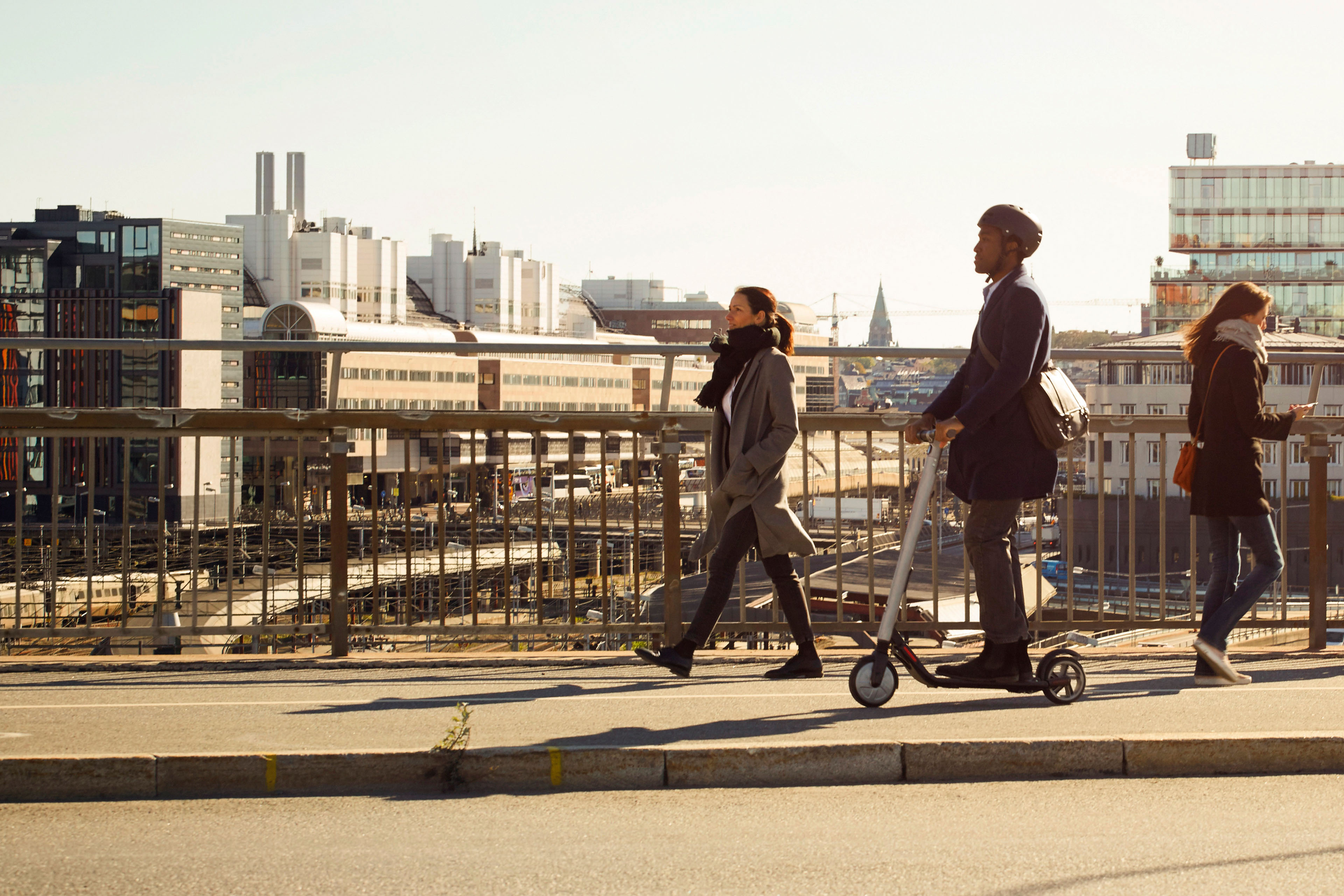 Businessman on electric scooter commuting to work