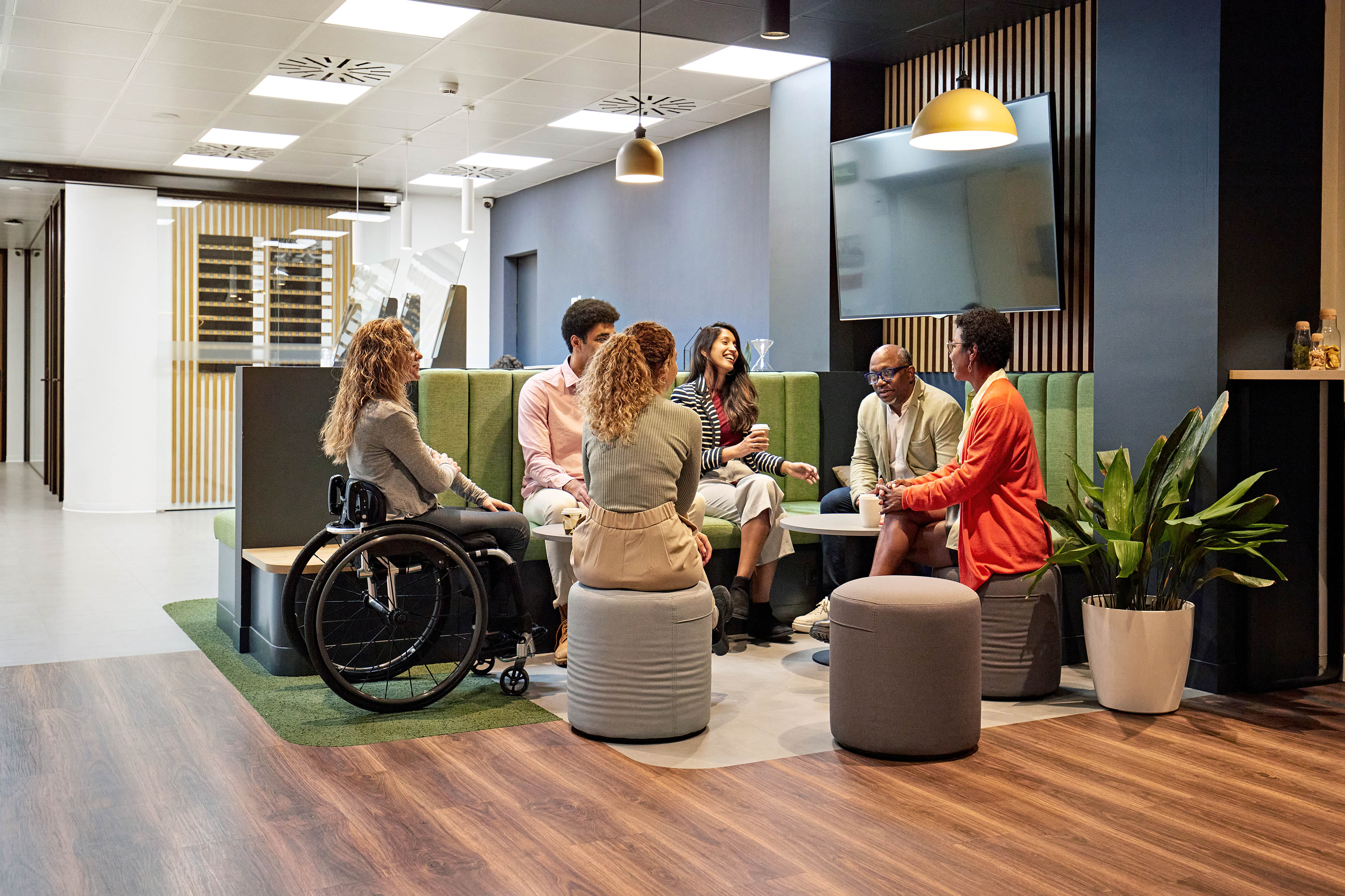 Business team meeting in modern office sitting area