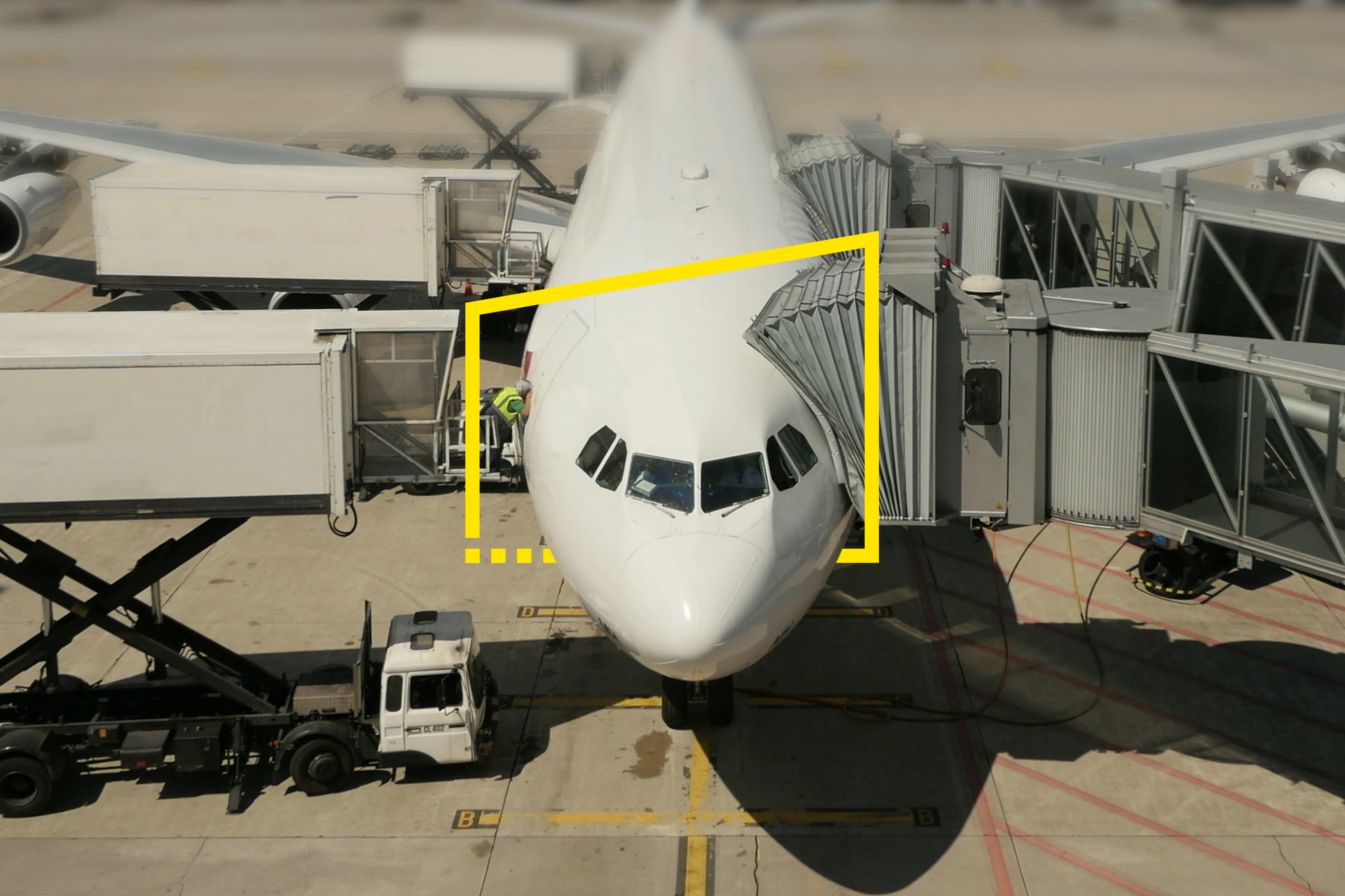 Commercial airplane standing at airport terminal gate