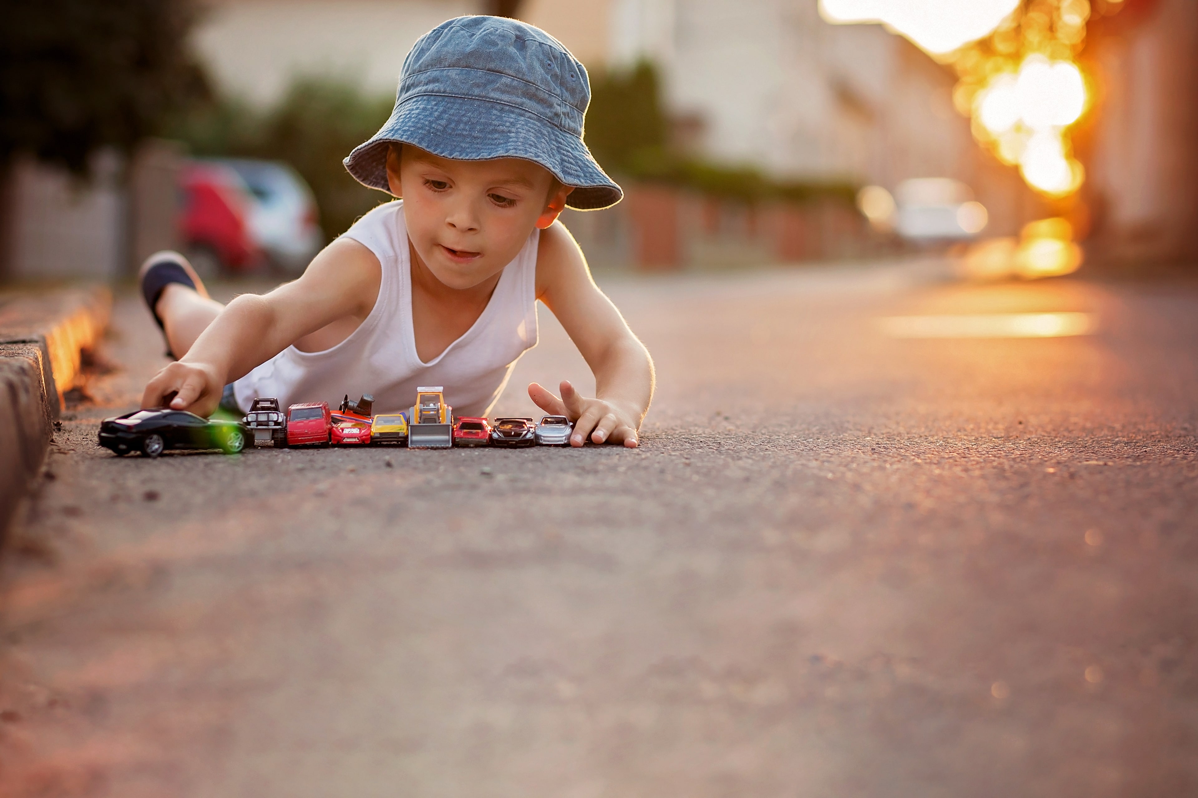 A child playing with toy cars