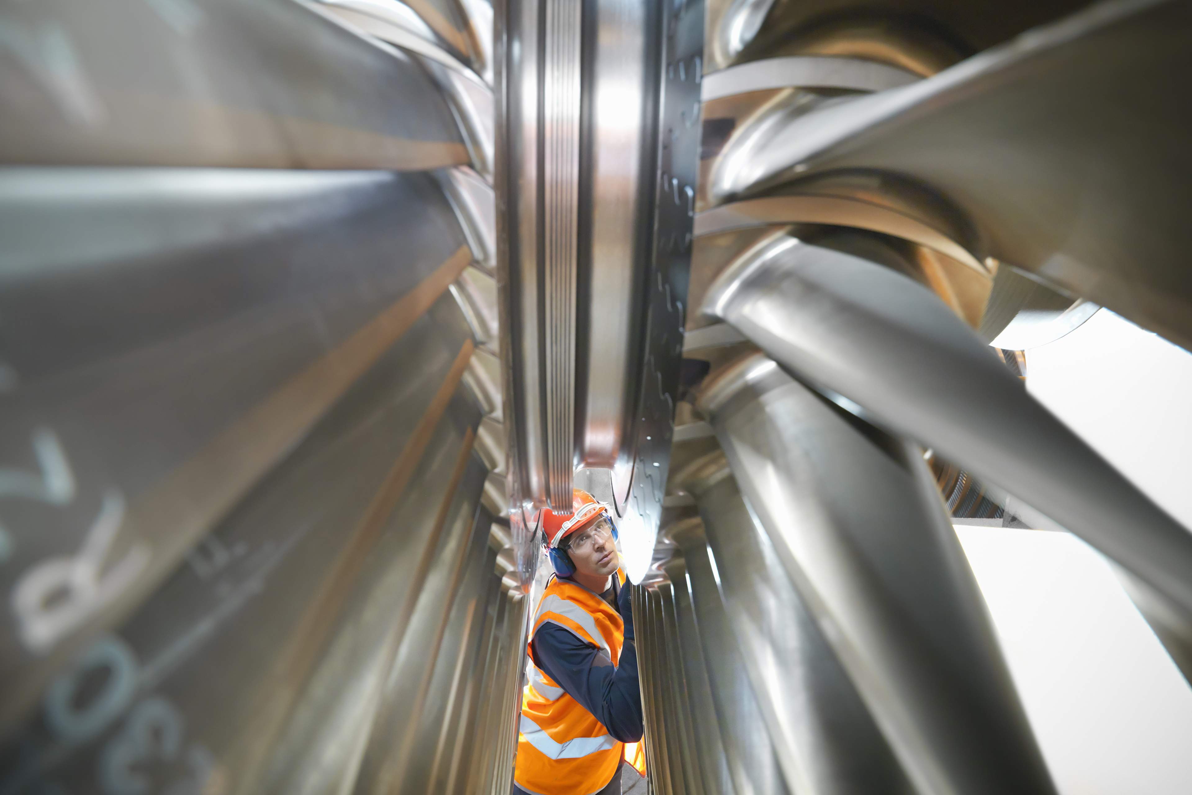 Worker inspects turbine power station