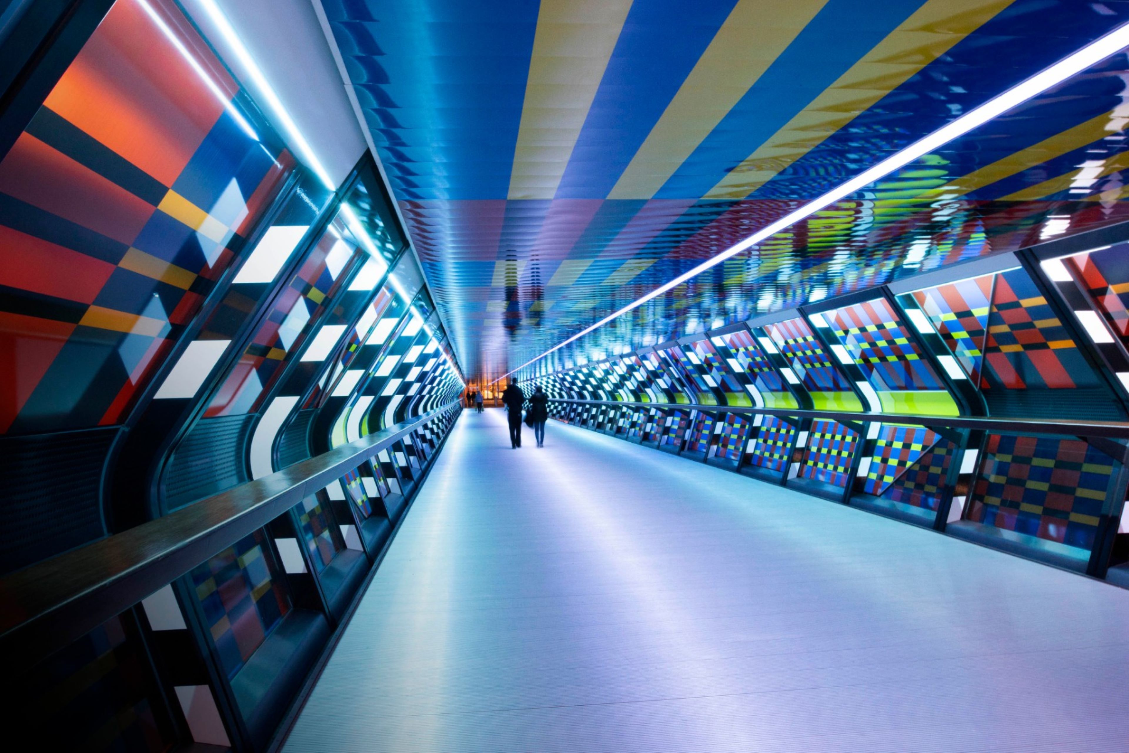 Interior of illuminated tunnel at night in London