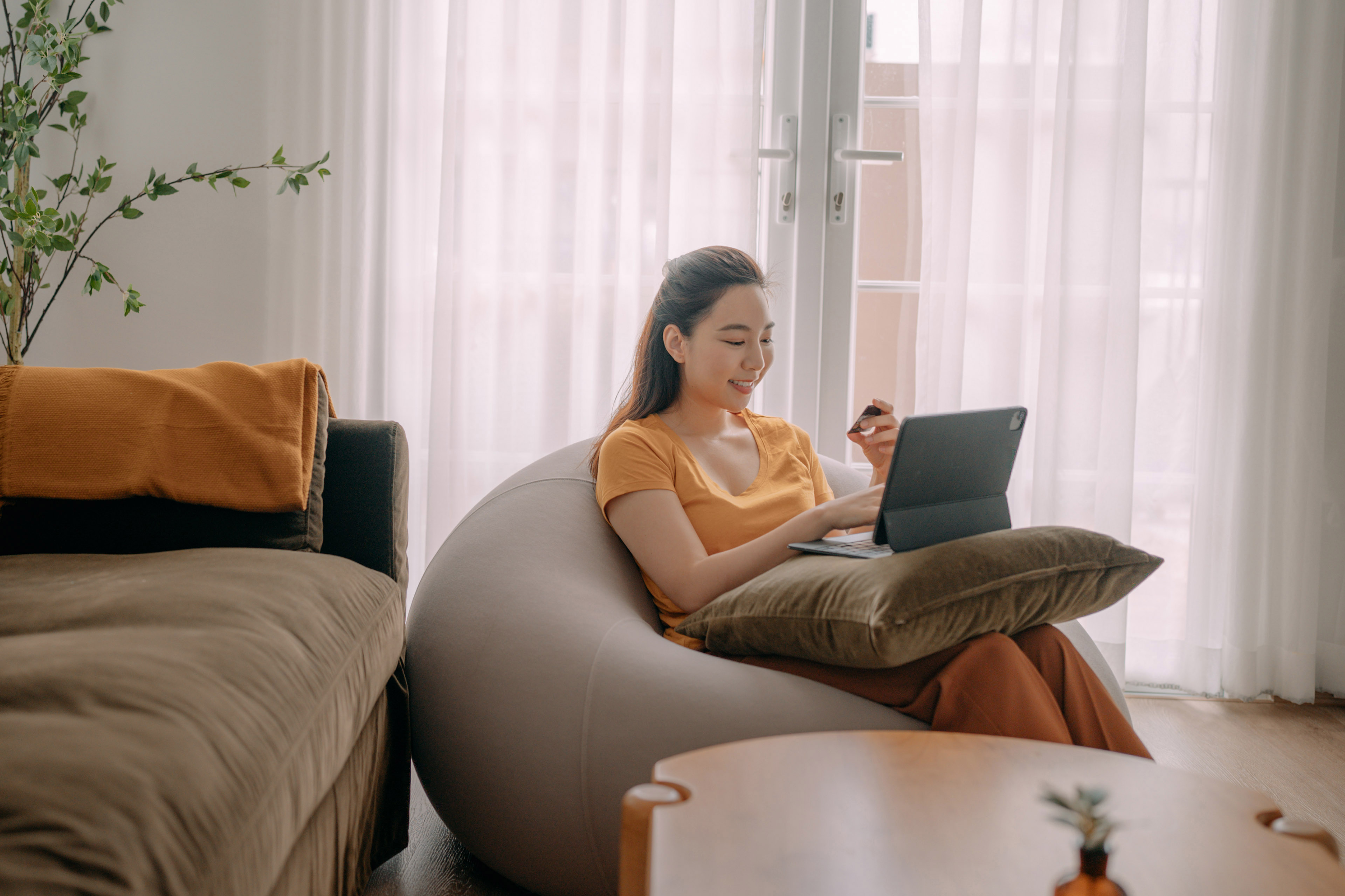 Young woman using credit card payment