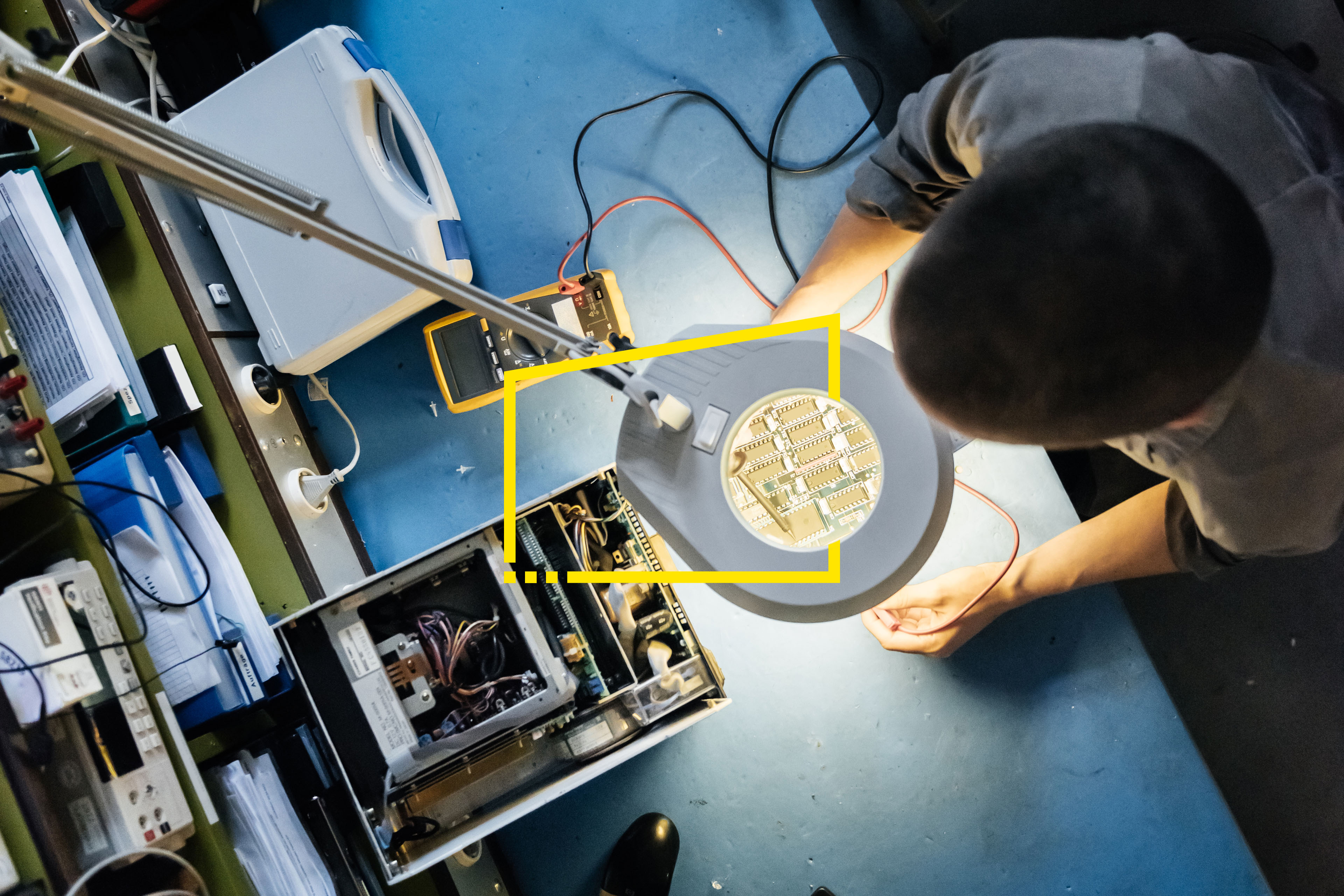 Female Technician Working In Workshop