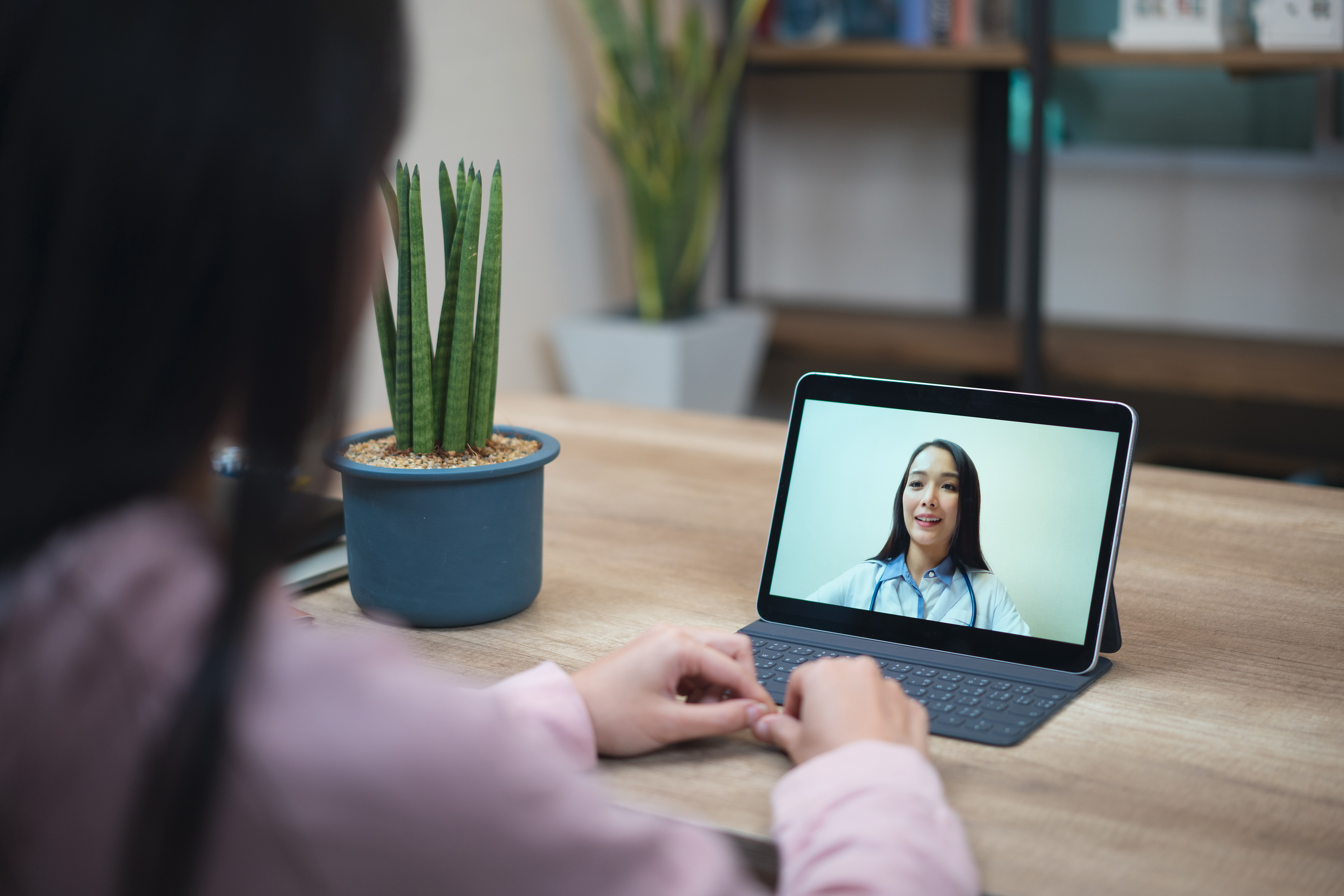 Patient talking to doctor using a digital tablet