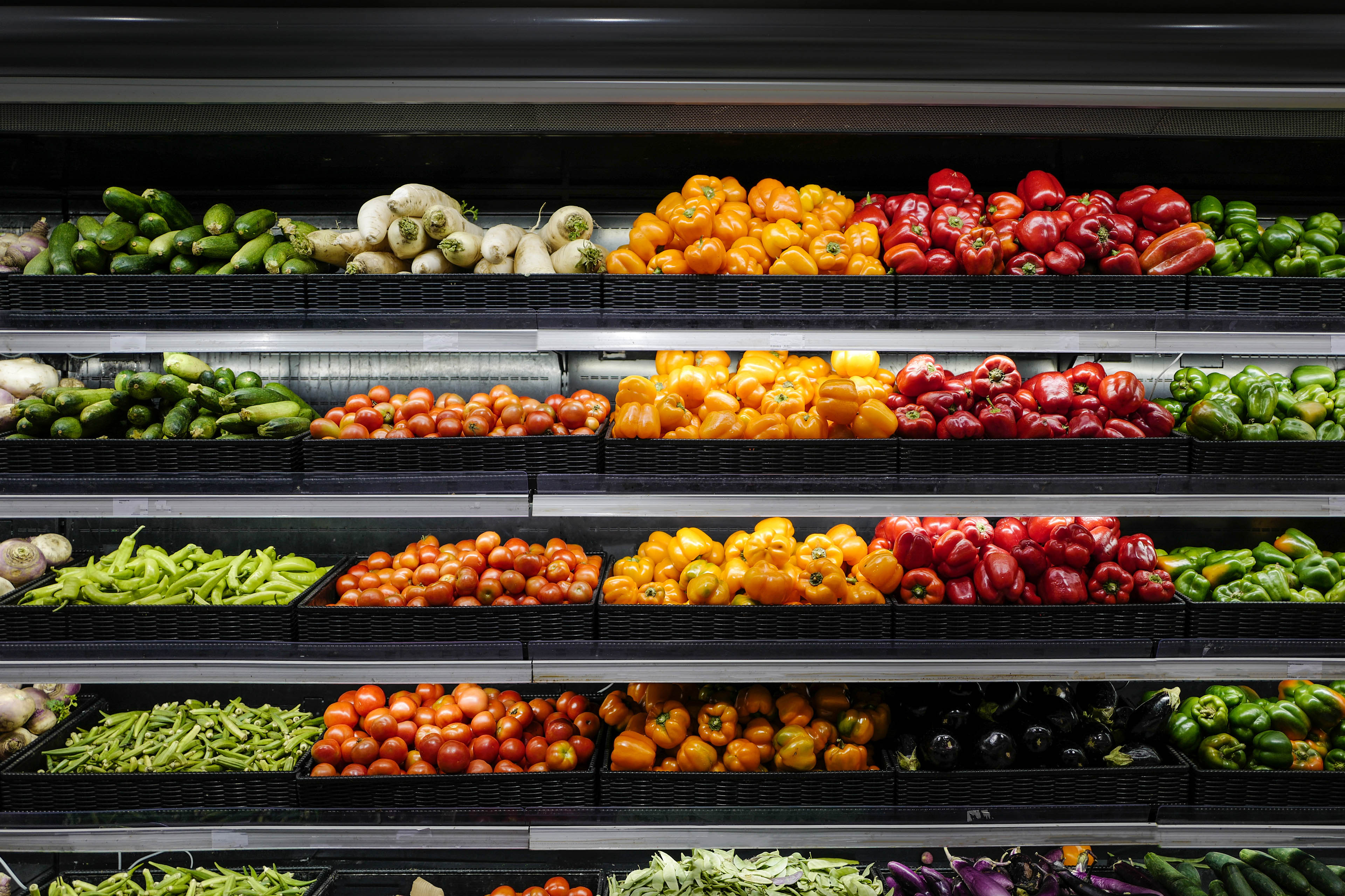 Organic produce in grocery store shelf, Vegetables For Sale In Market.