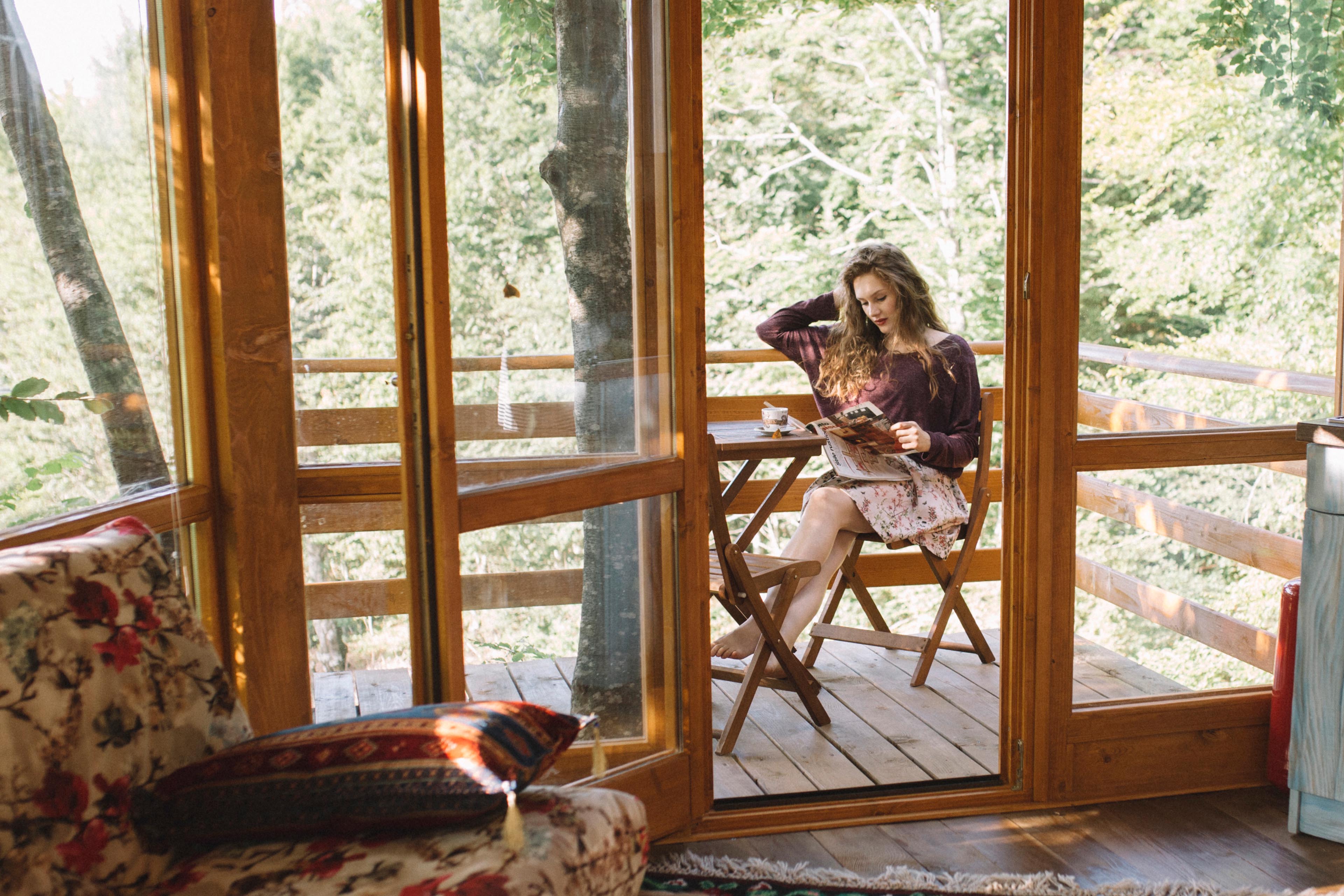 Woman sitting on chair in room