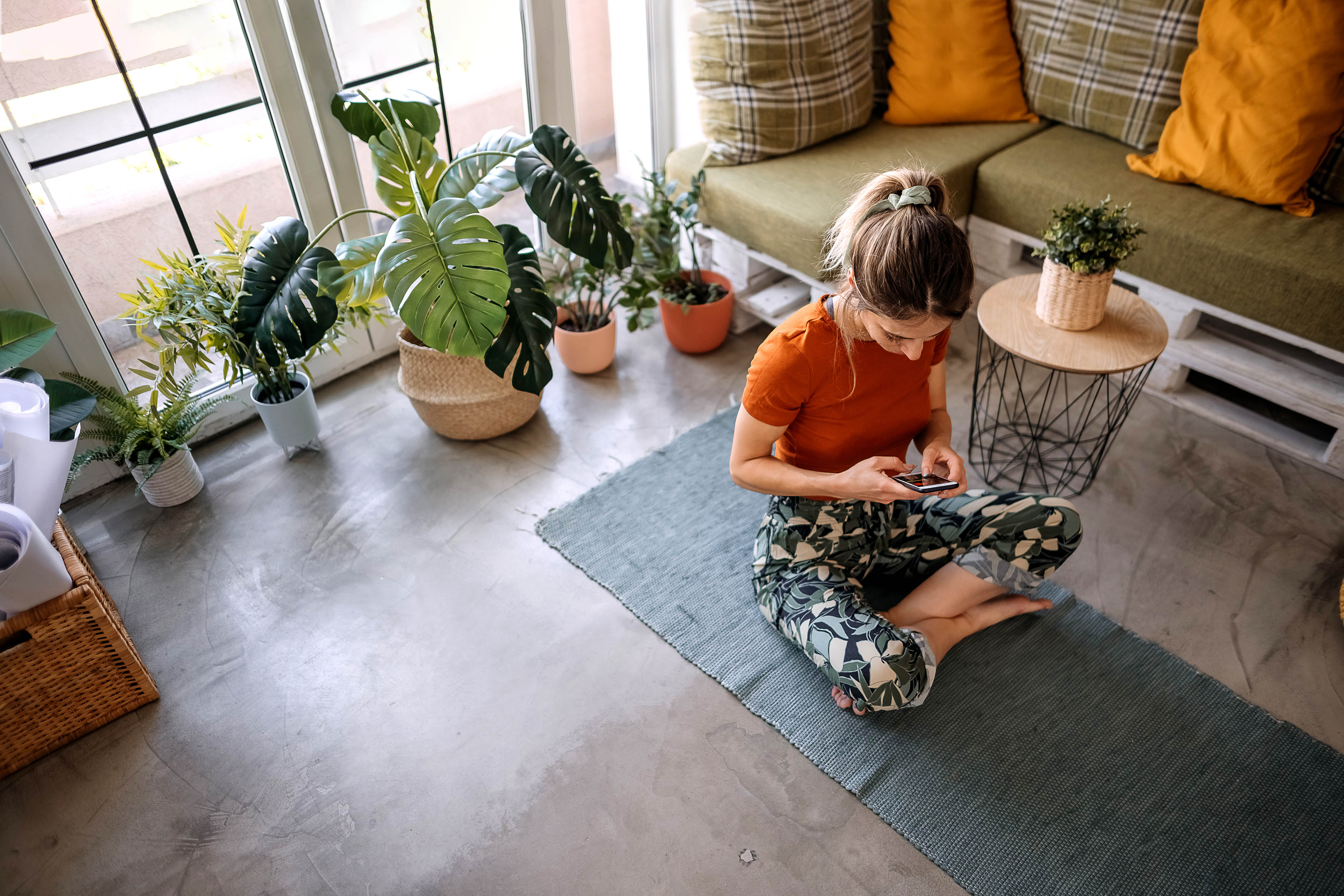 Young woman looking for yoga positions on the internet