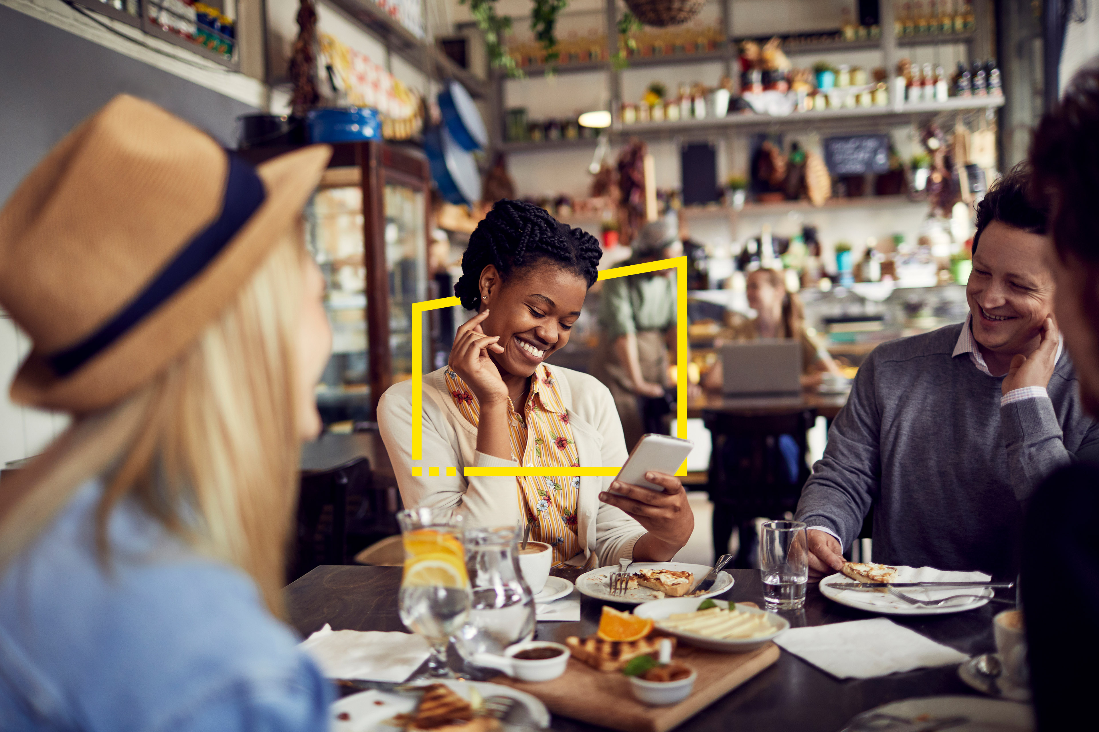 A photograph of a group of friends in a cafe.