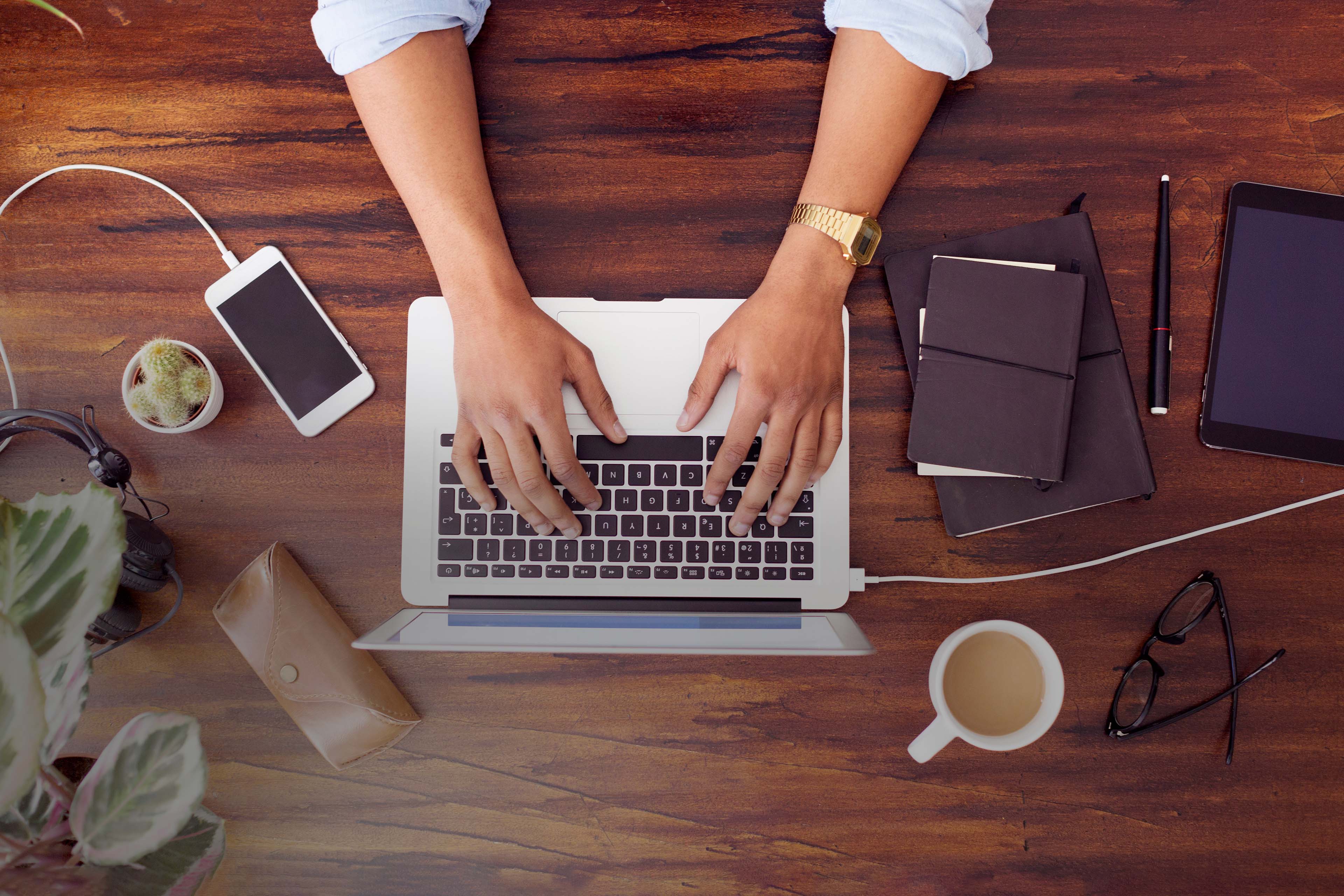 Businessman using laptop at desk