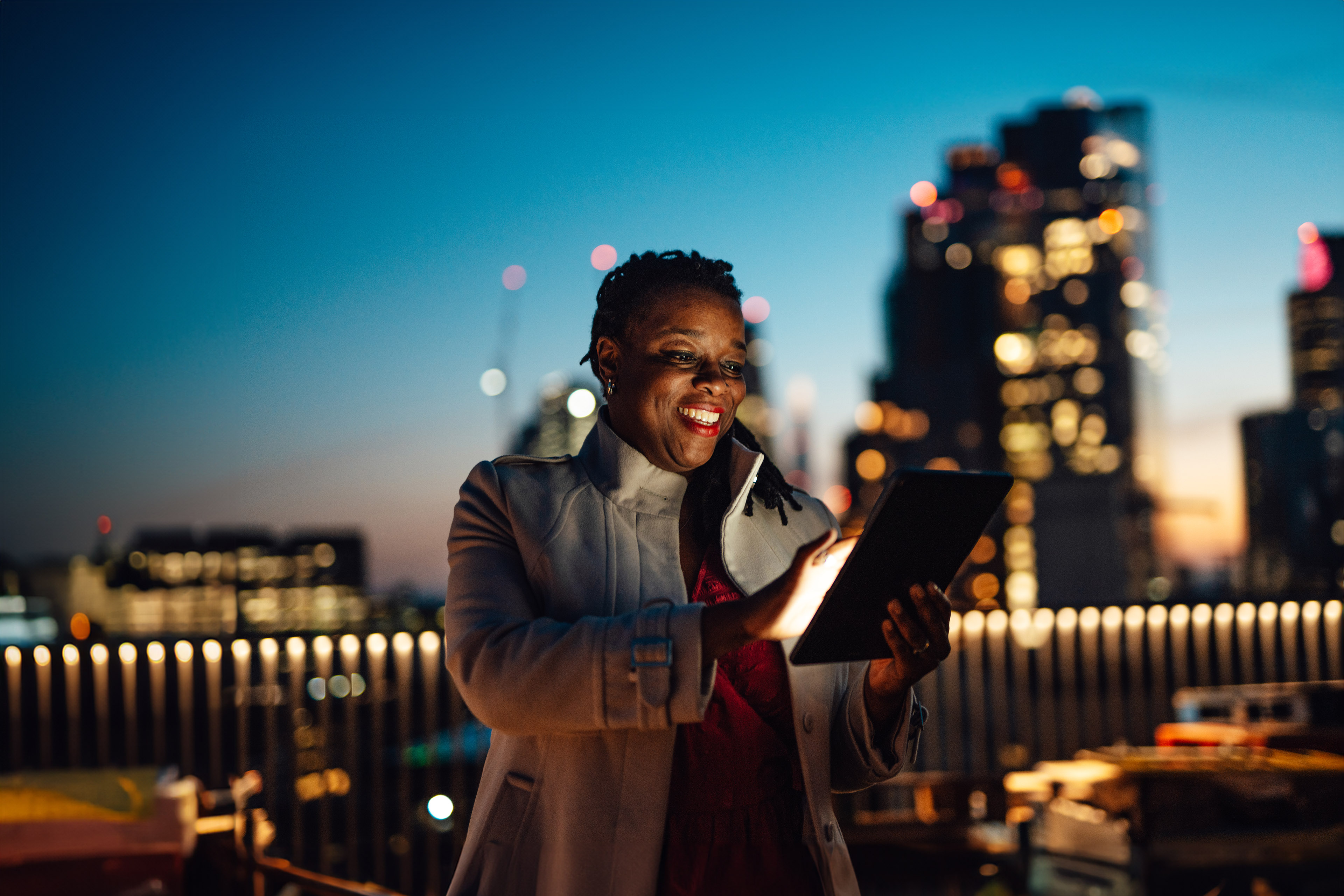 Businesswoman using digital tablet at rooftop