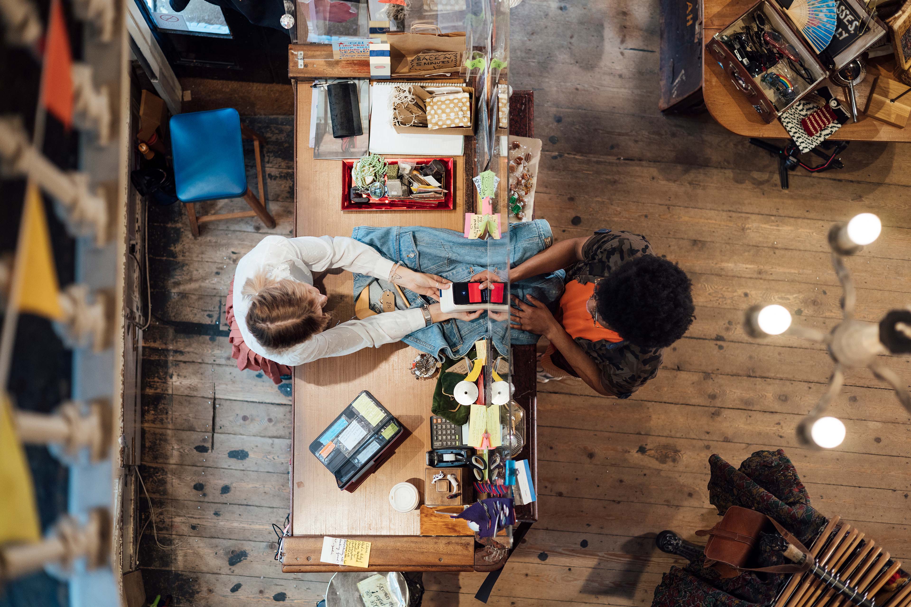 Customer paying via contactless payment with his mobile phone