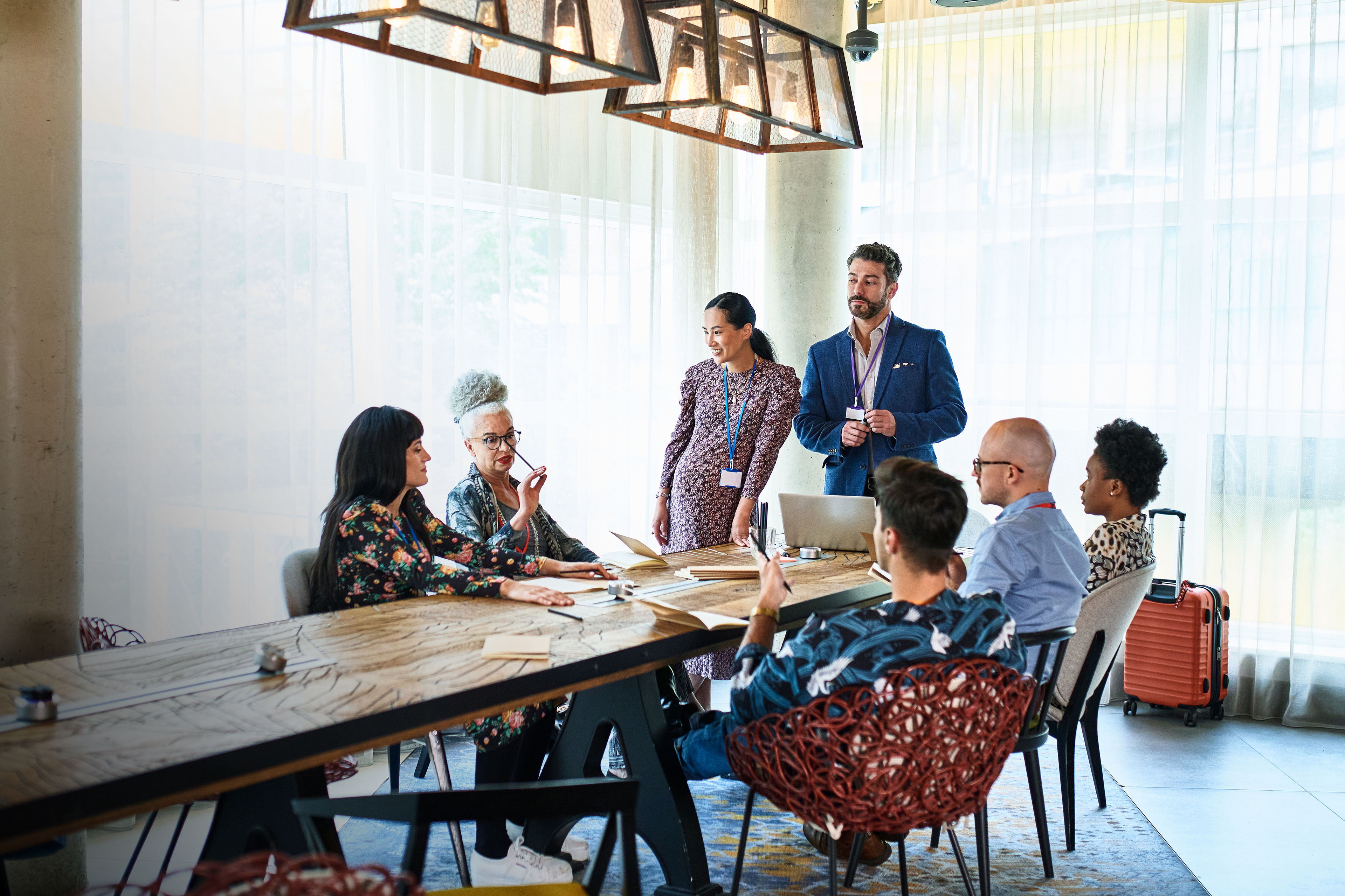 Diverse multi racial business colleagues at meeting table