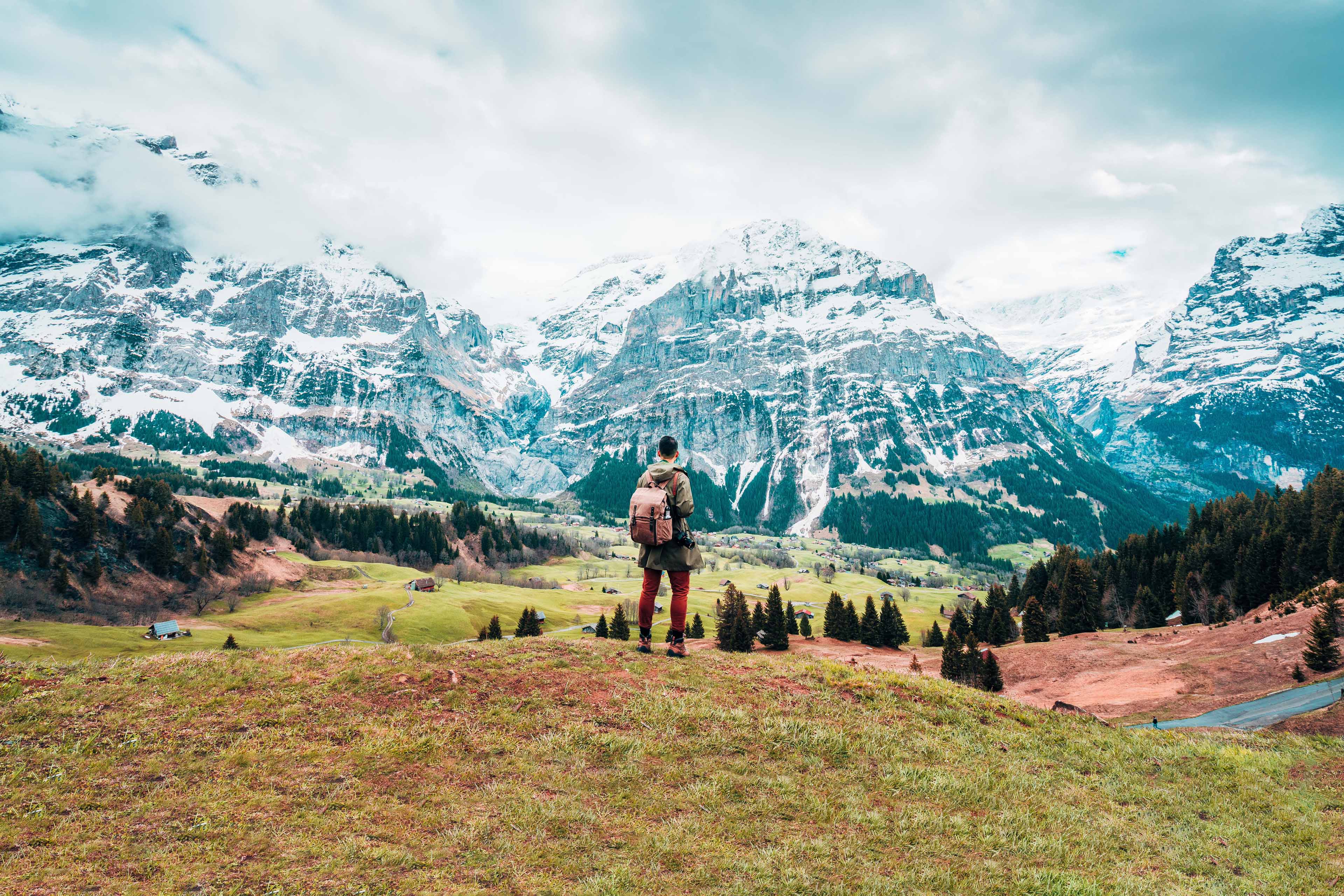 Man standing on mountain against sky