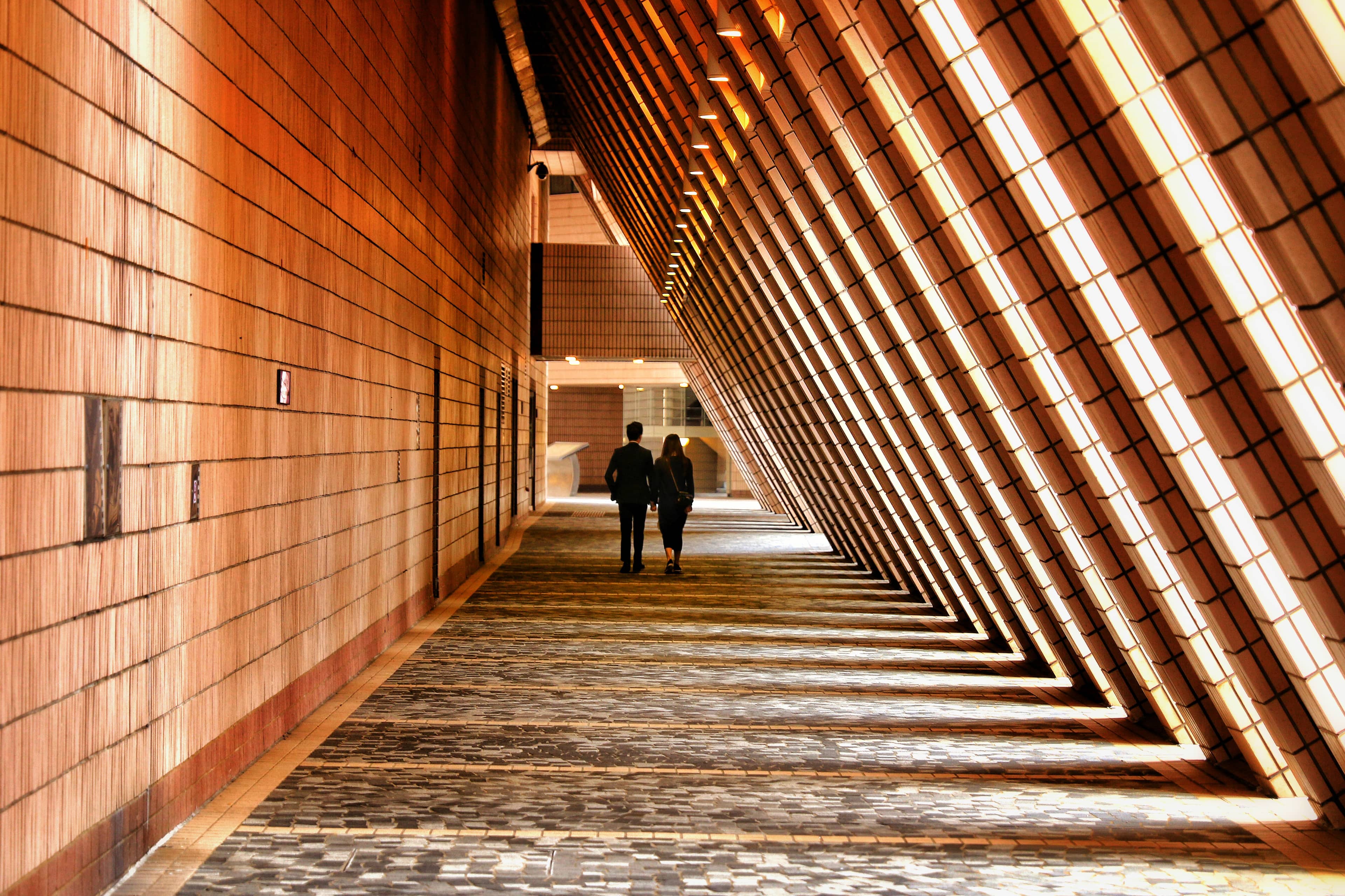 People walking inside corridor of a building