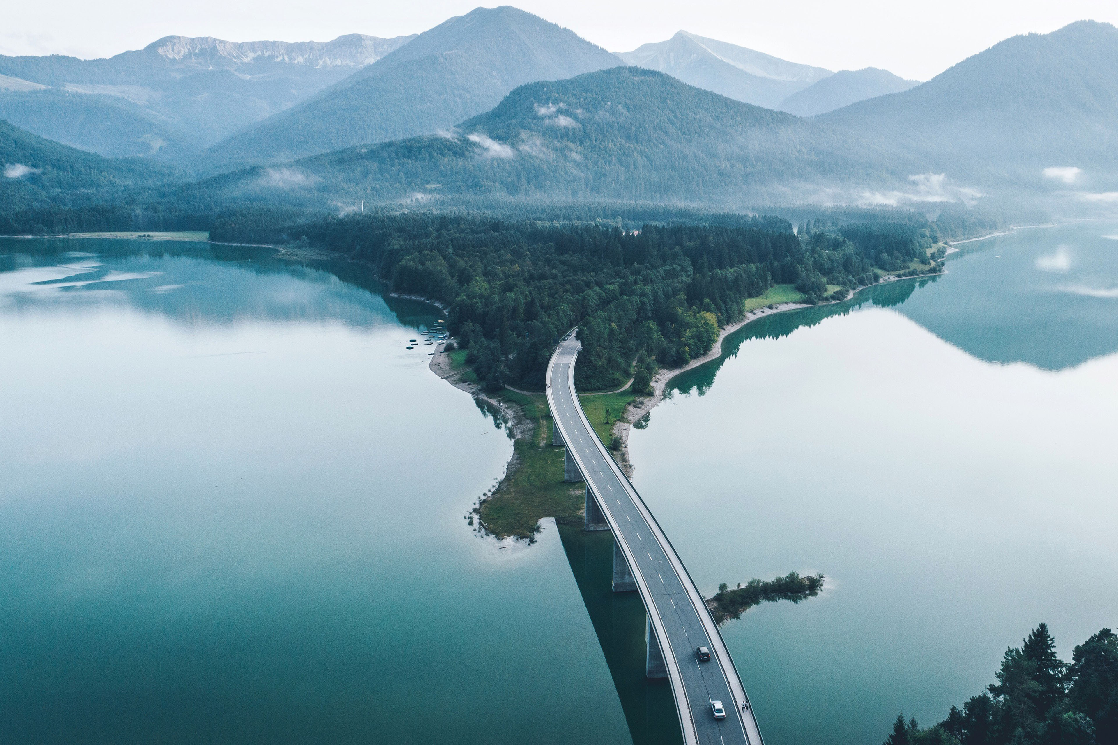 Scenic view of lake amidst mountains against sky