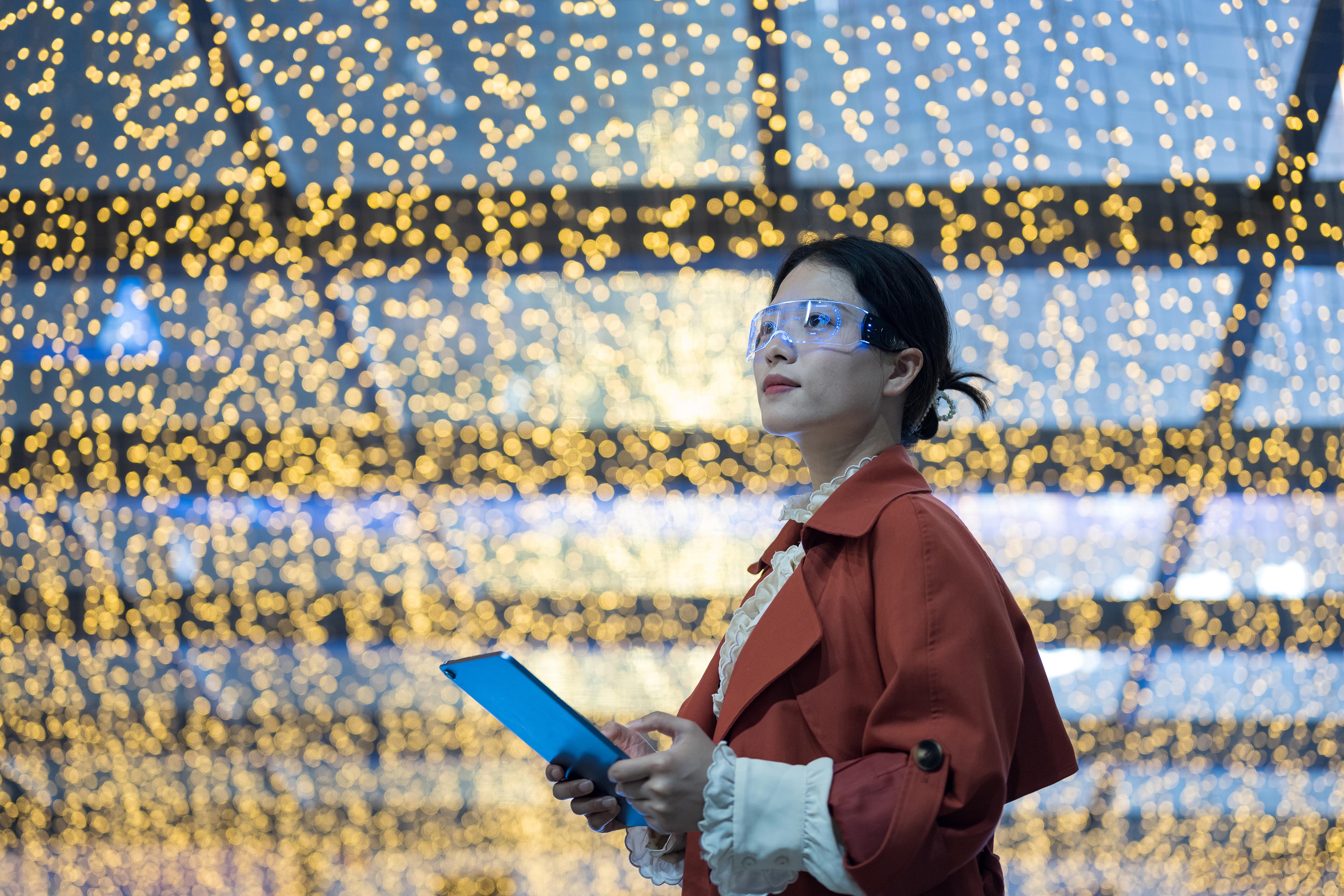 Young asian business woman wearing augmented reality glasses