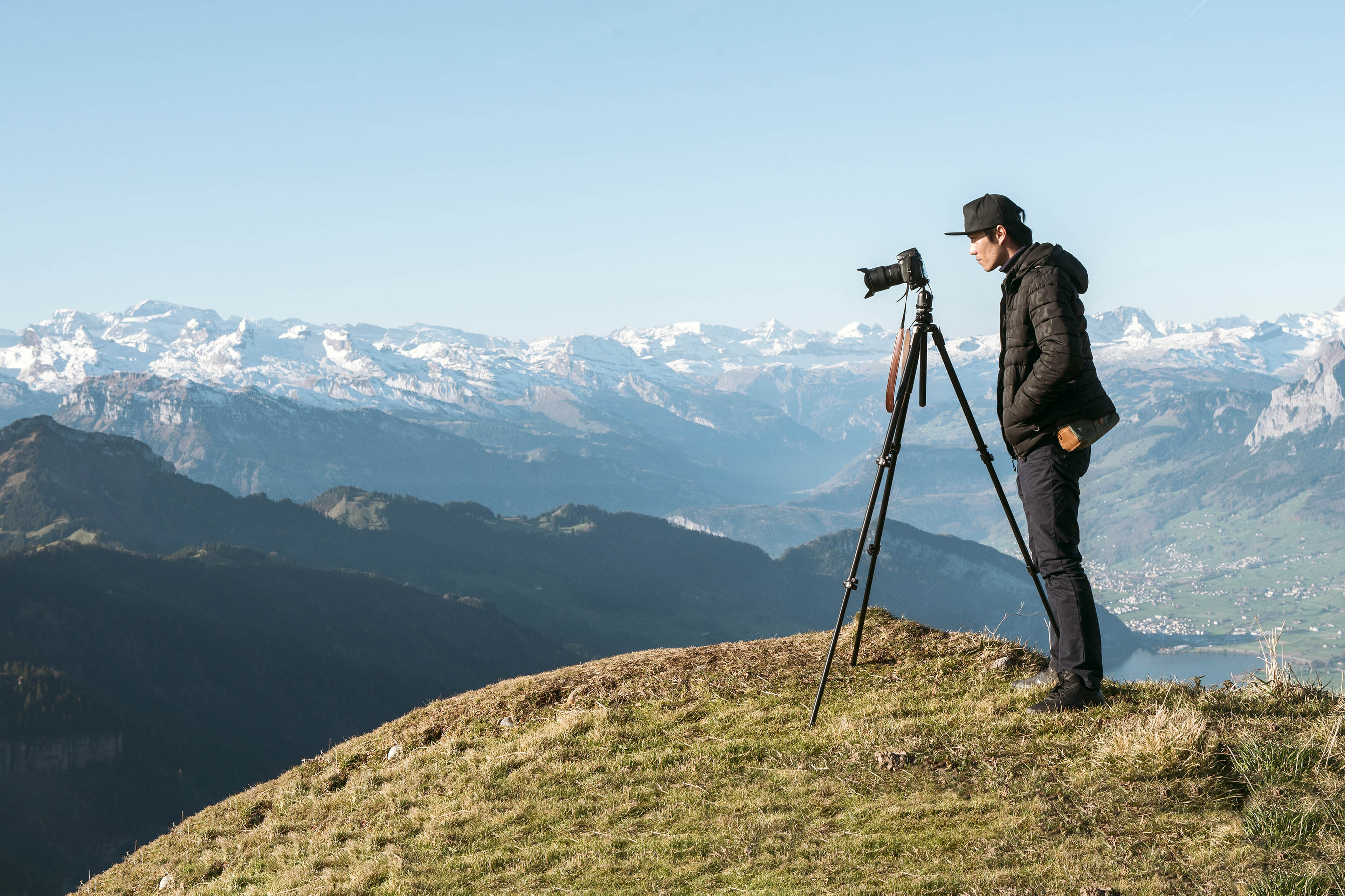 A man photographing a mountain view