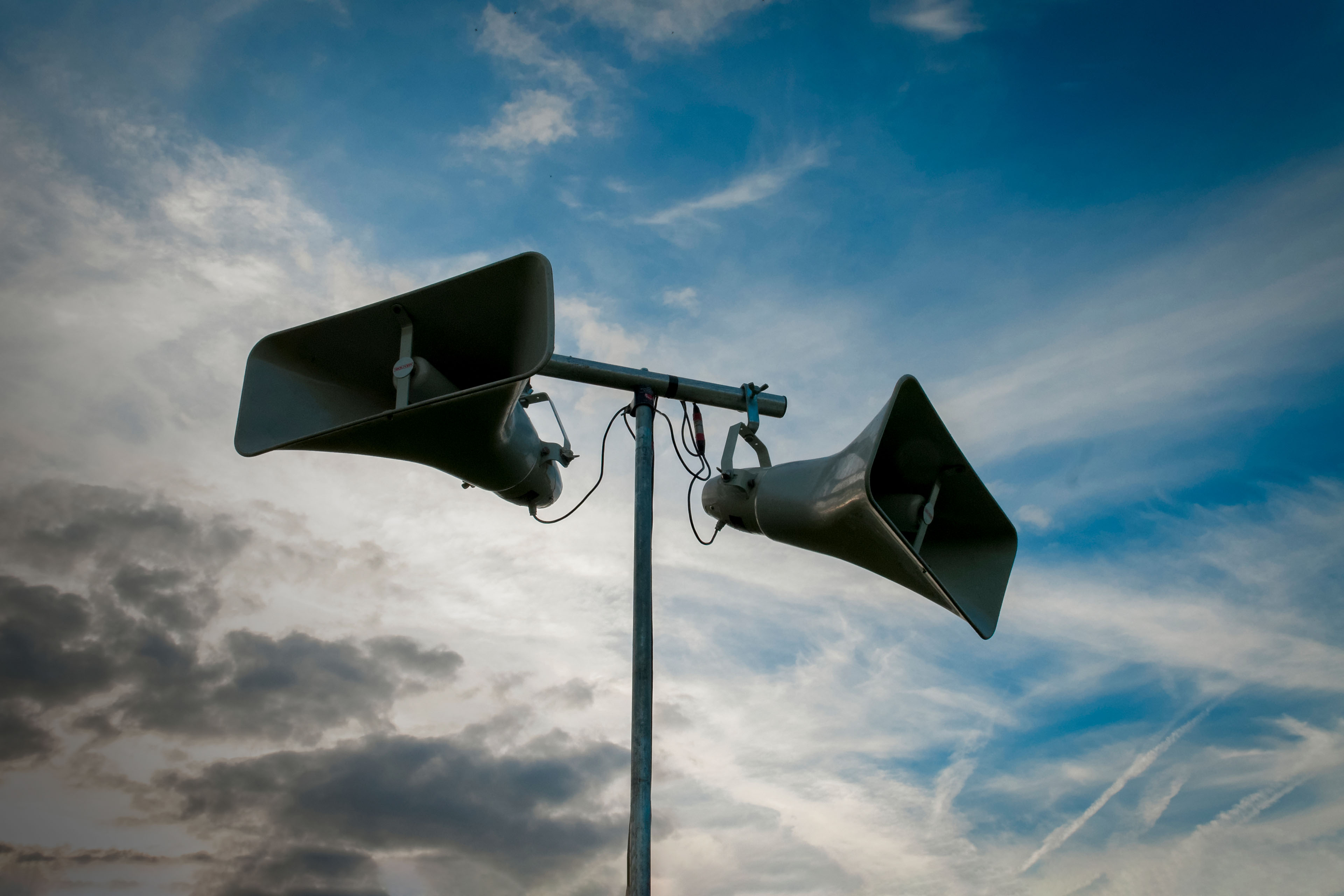 Public address system against a blue sky