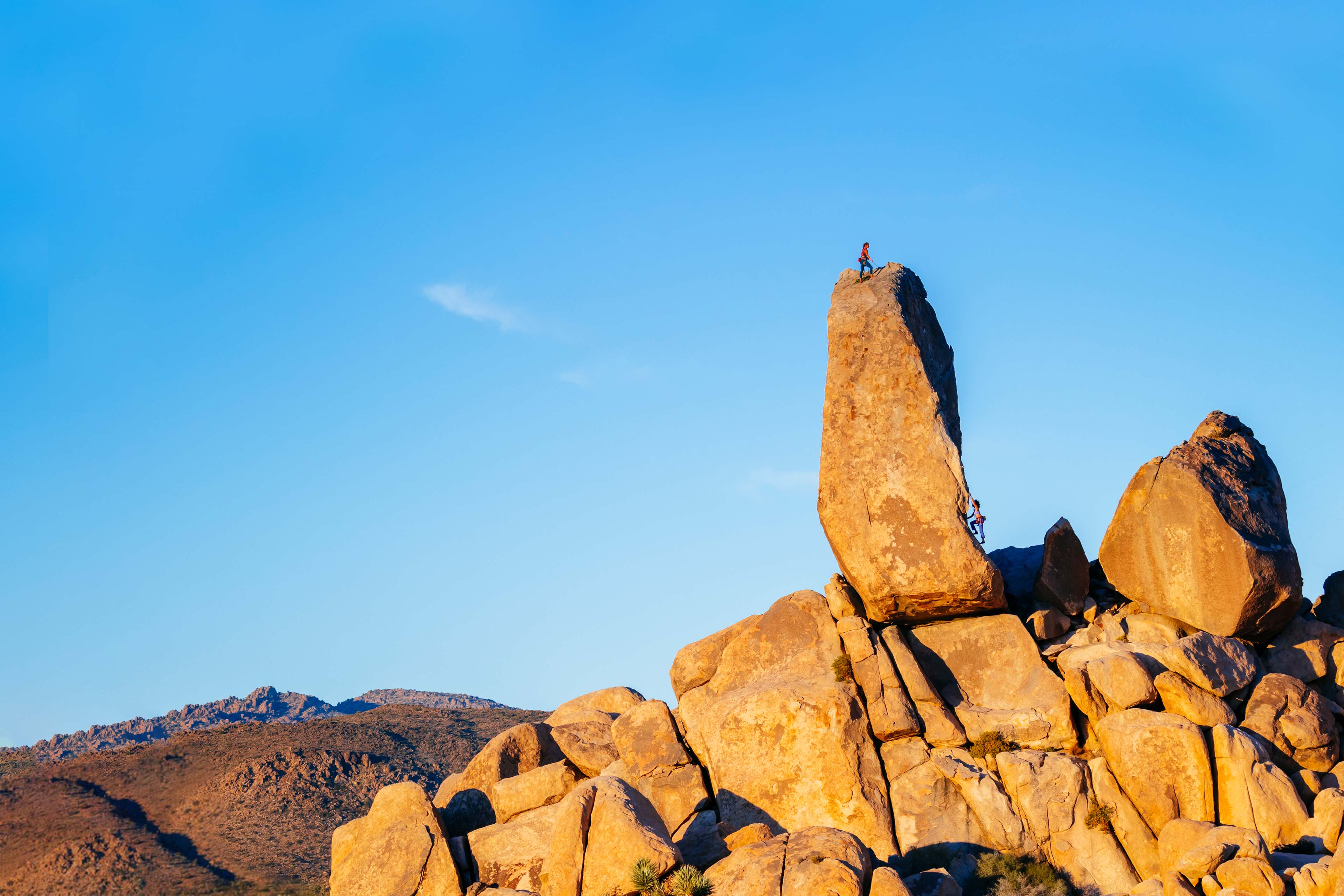 Two women climbing a stack in a National Park, USA