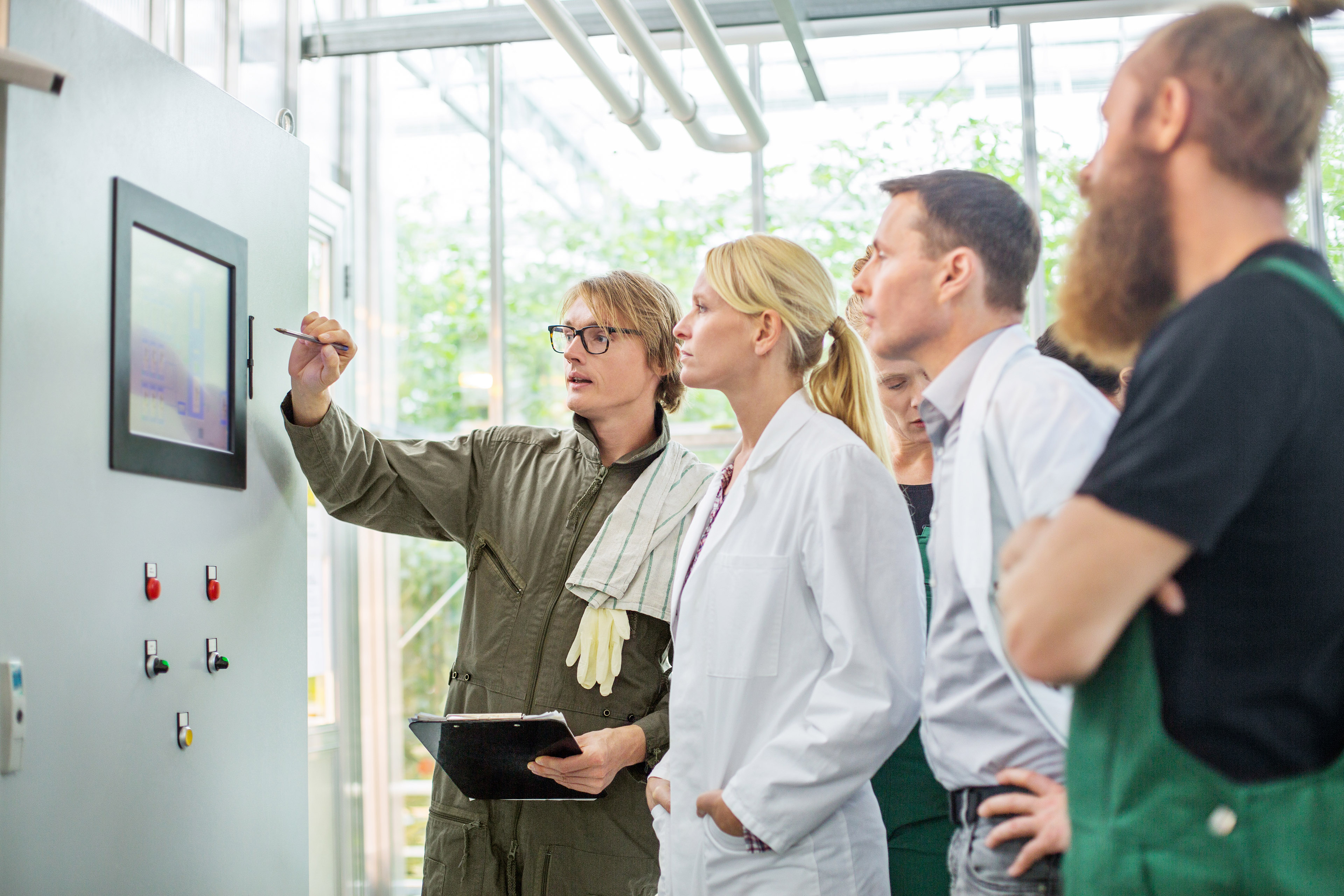 Farm worker scientist greenhouse control panel