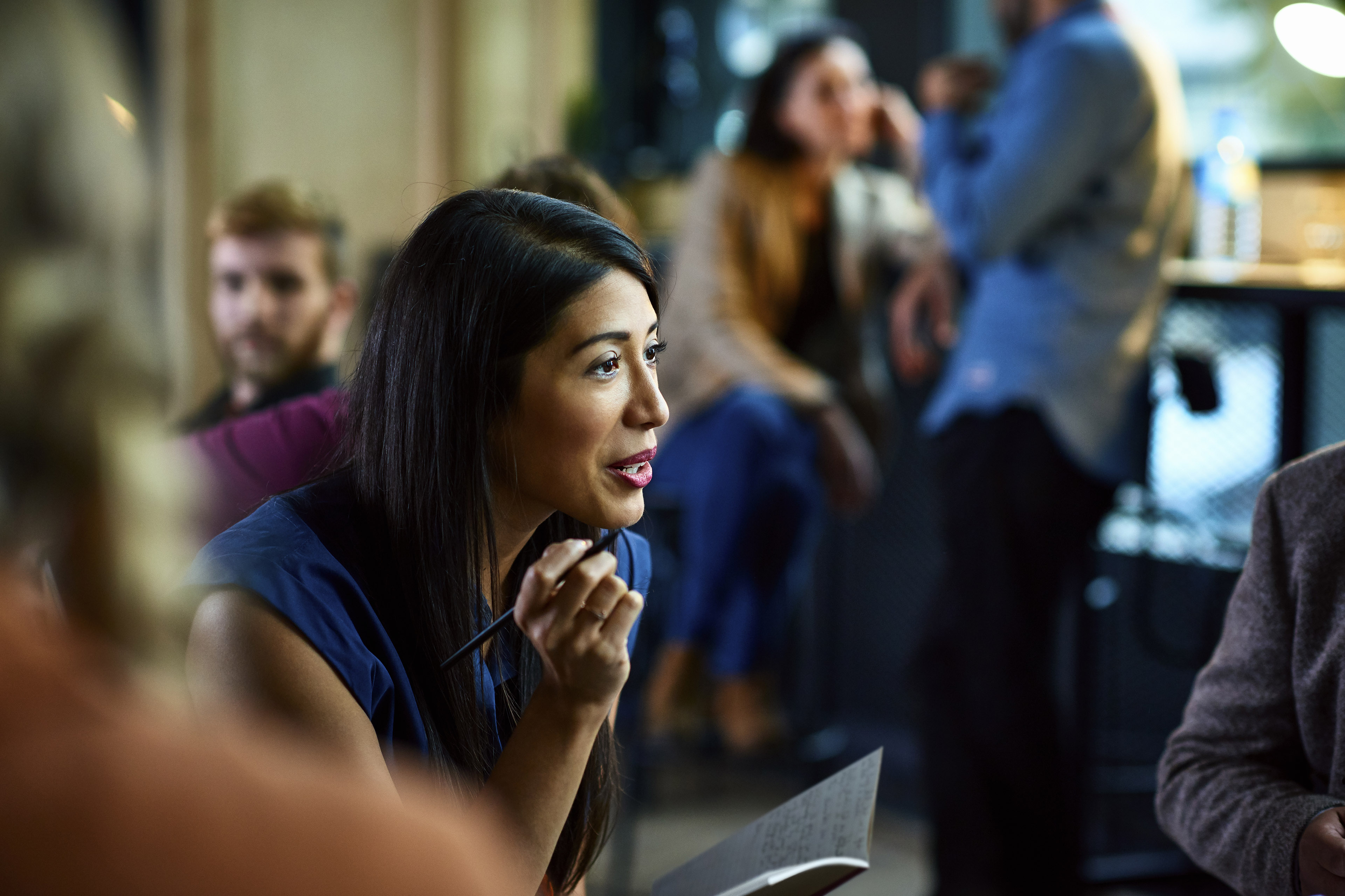 Businesswoman taking notes office meeting