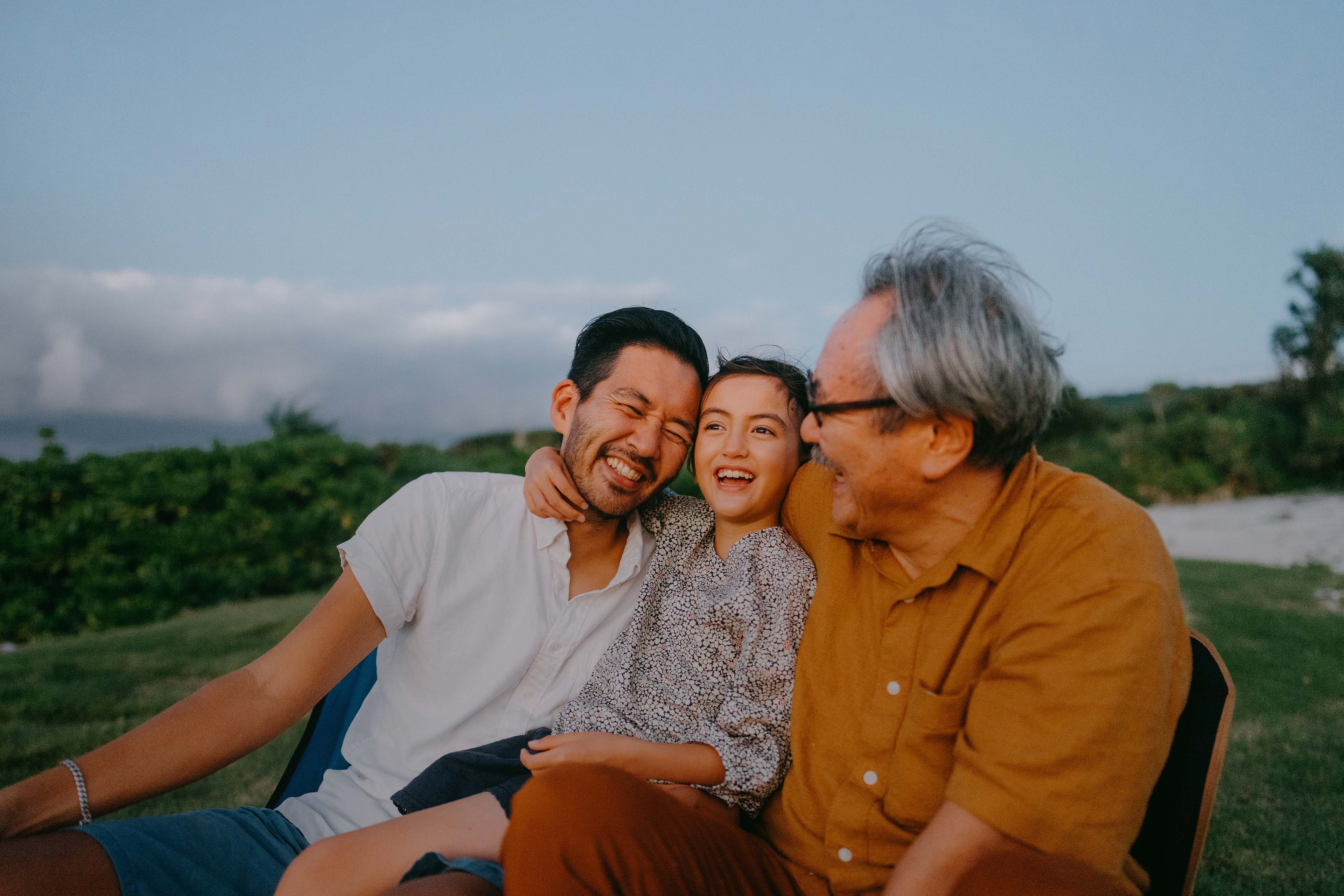 Three generation family having a good time at dusk