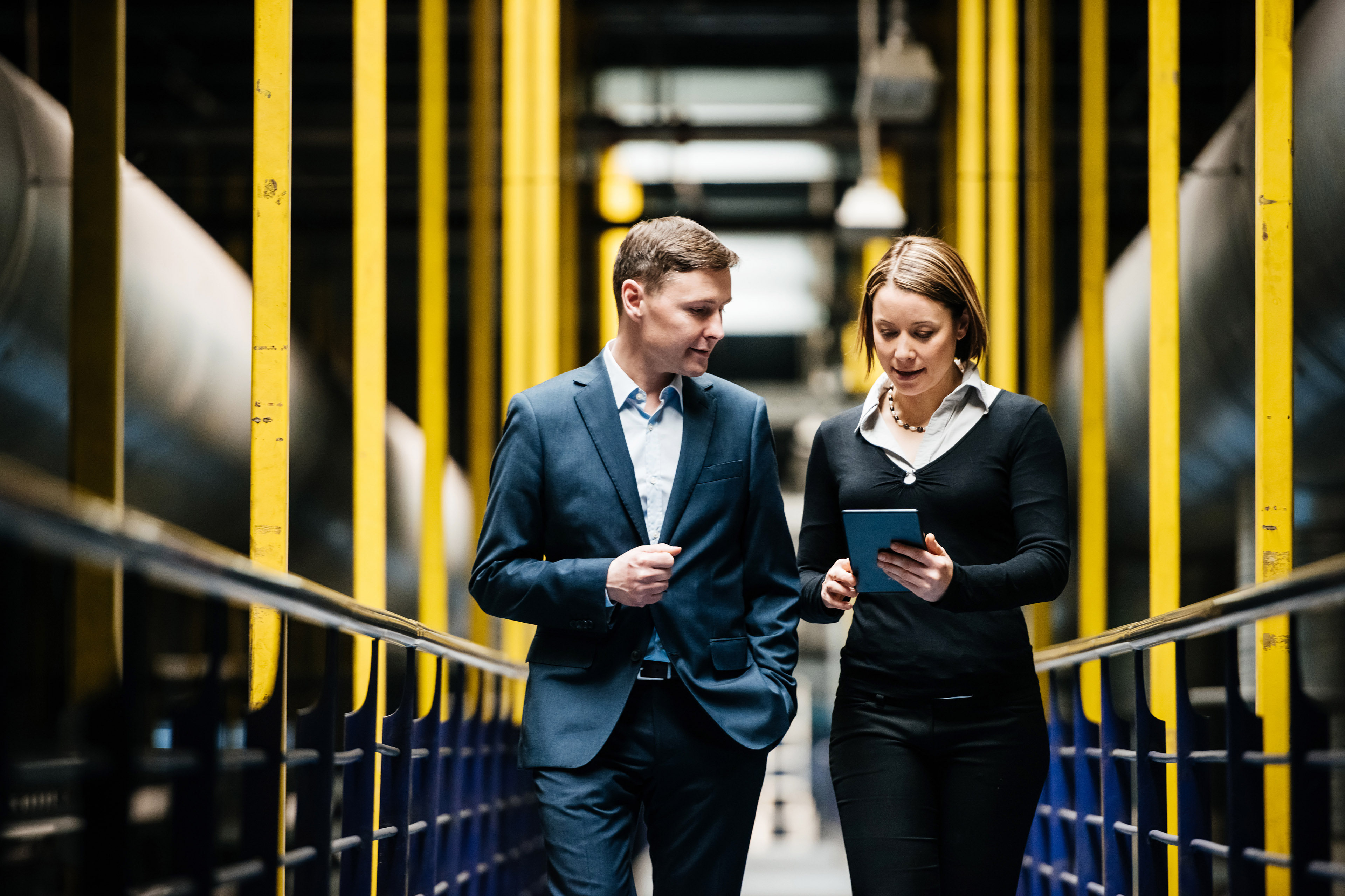  Two Business people Walking Dark Hallway