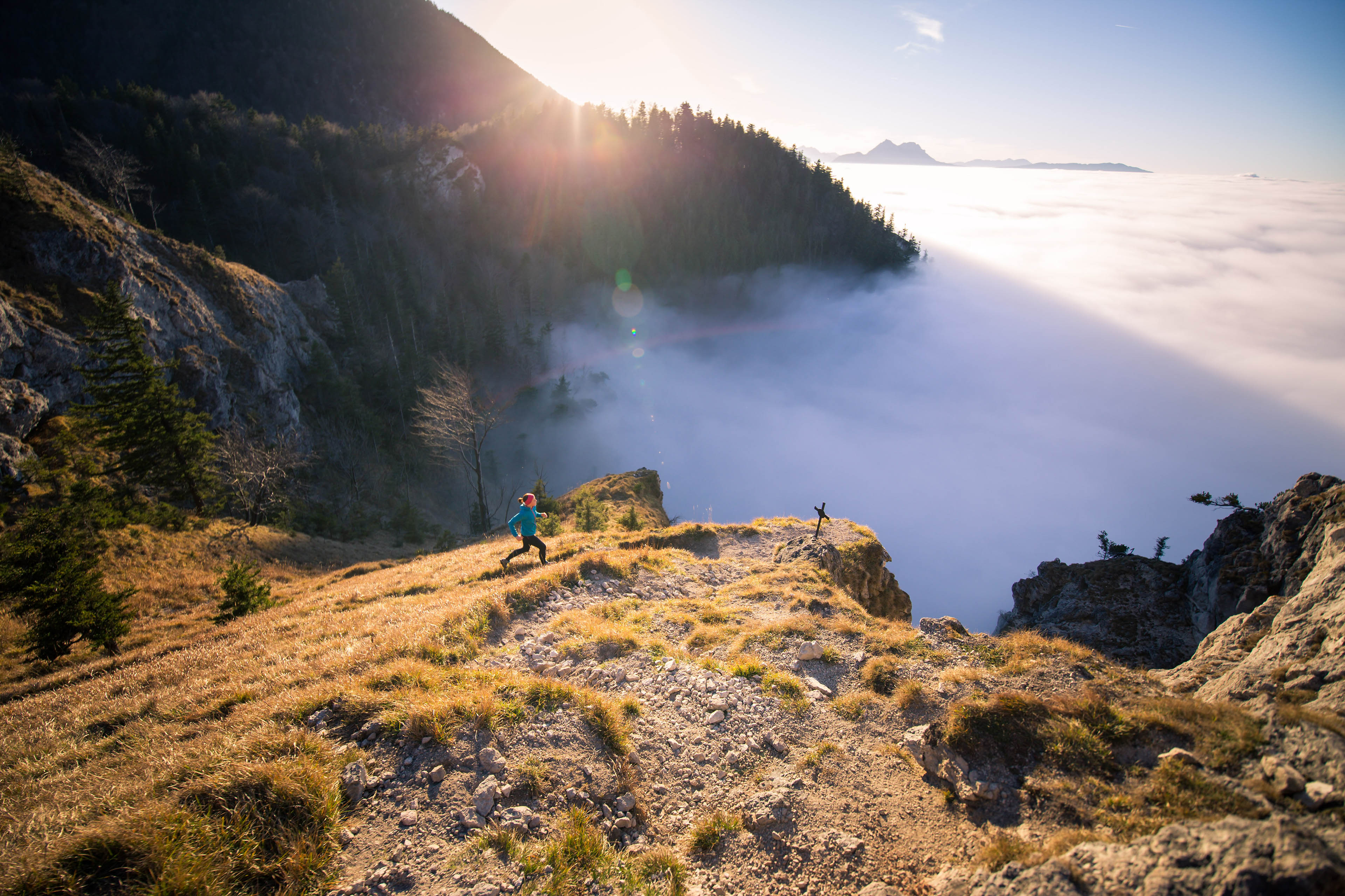 Woman trail running in the mountains