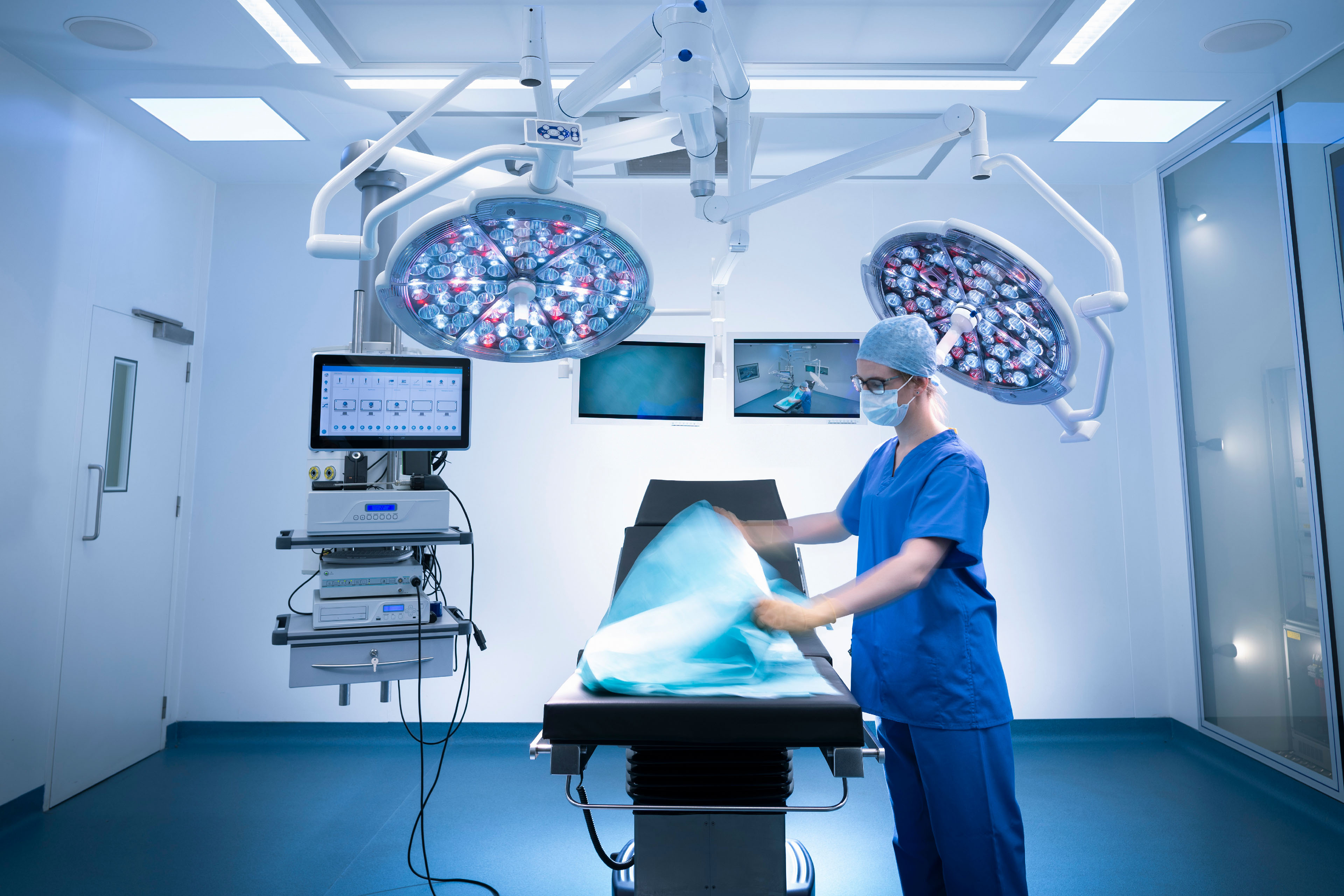 Nurse preparing operating theatre in hospital setting static