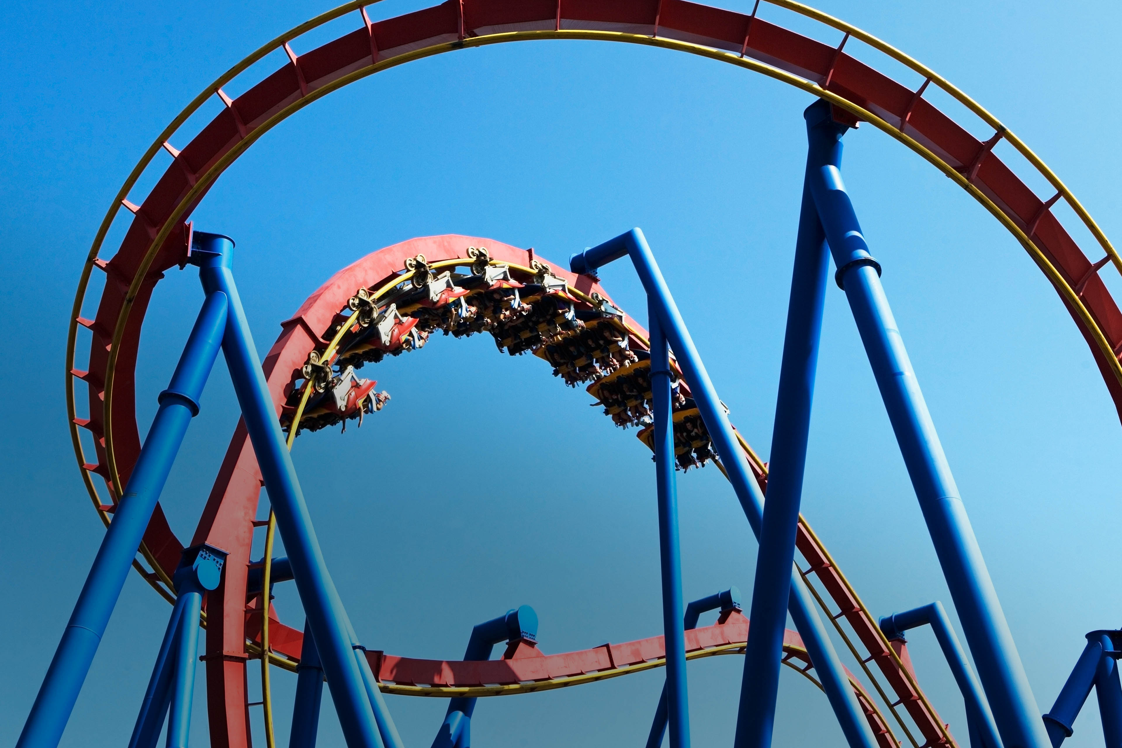 Rollercoaster against blue sky